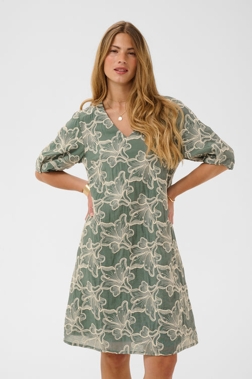 Cream CRTorli short dress in Mulled Basil green featuring a textured floral design, V-neckline and elbow-length sleeves.