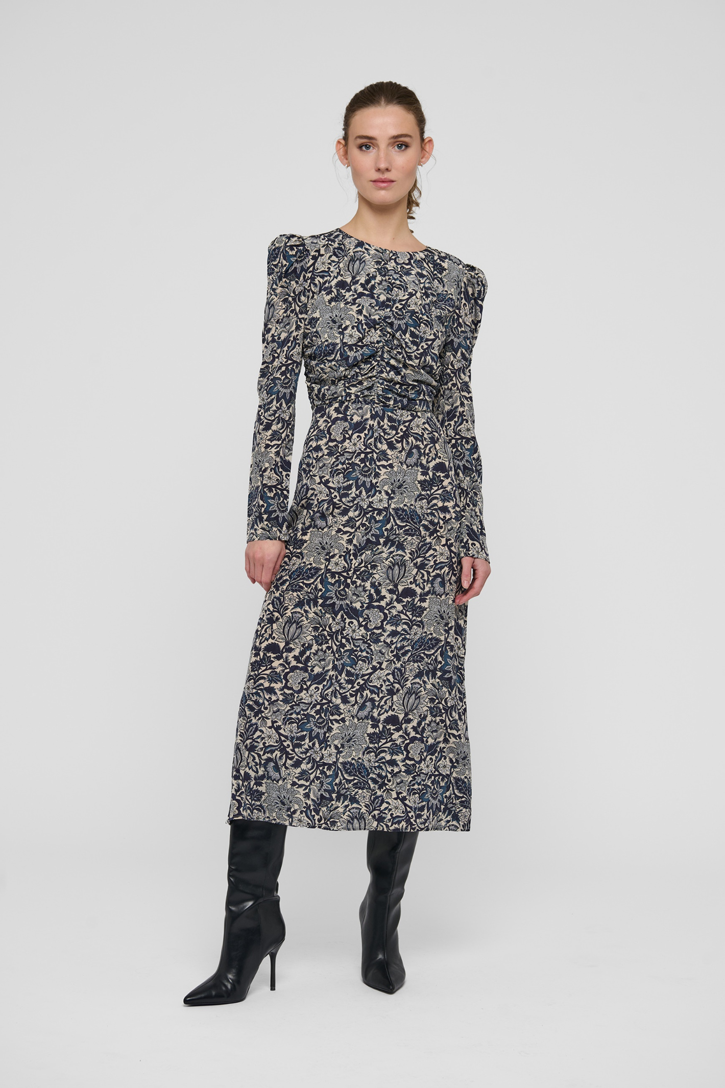 Shop the Dea Kudibal ClaudiaDEA Dress in Dentelle Midnight at Dotique. A luxurious stretch silk midi dress with a flattering ruched waist and floral print.