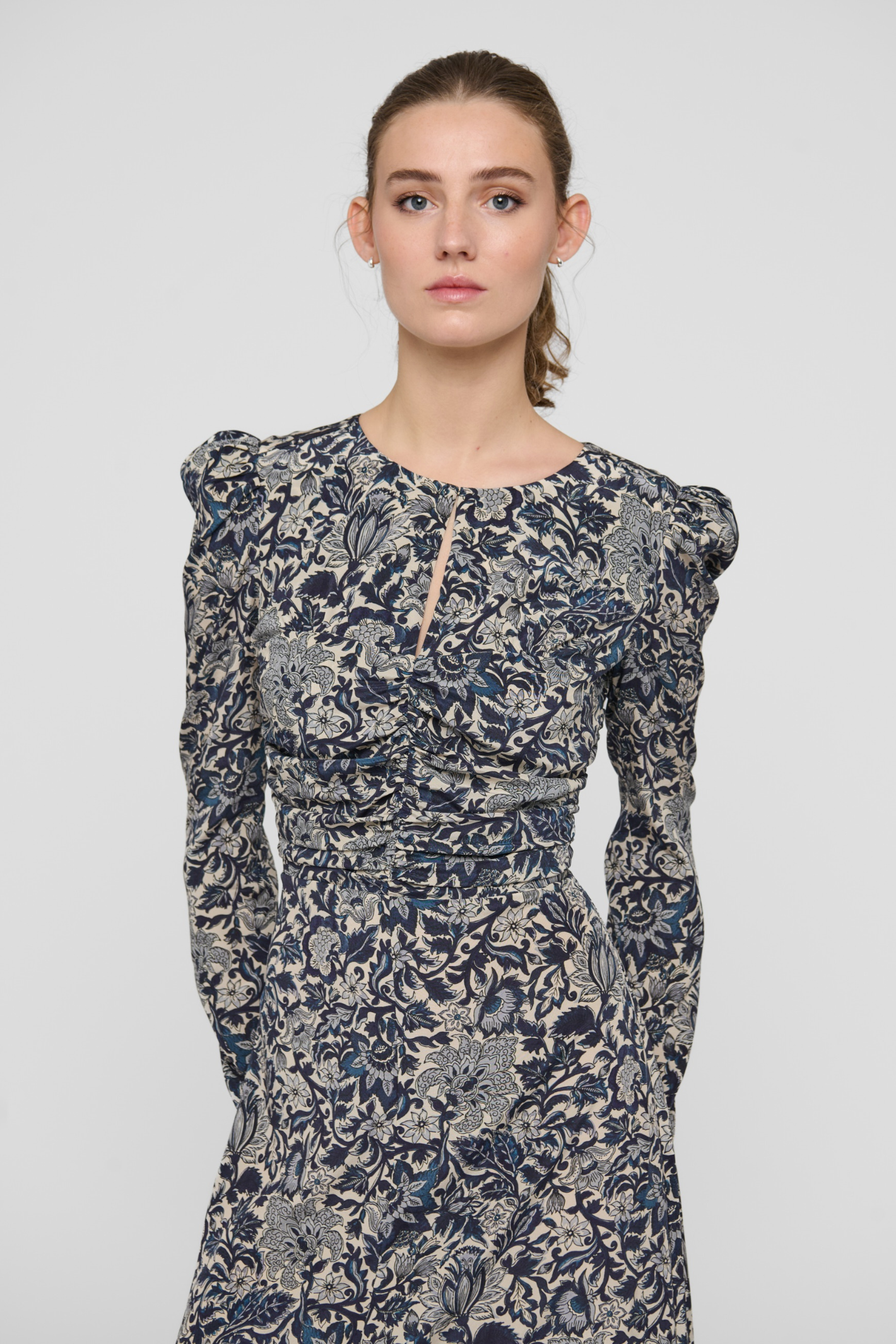 Shop the Dea Kudibal ClaudiaDEA Dress in Dentelle Midnight at Dotique. A luxurious stretch silk midi dress with a flattering ruched waist and floral print.