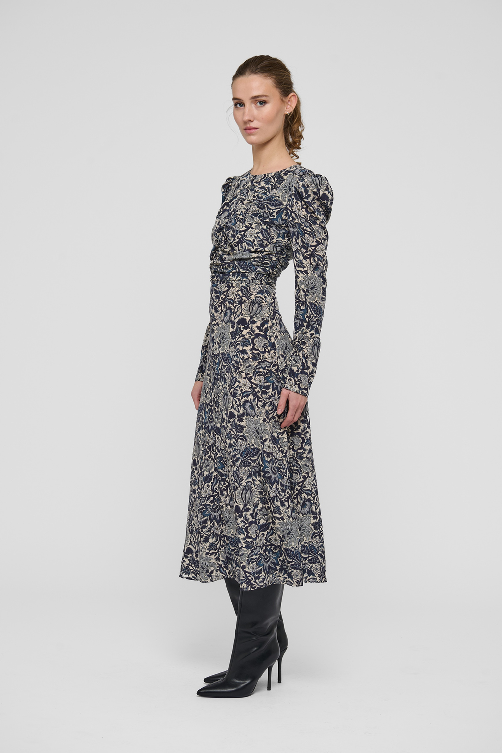 Shop the Dea Kudibal ClaudiaDEA Dress in Dentelle Midnight at Dotique. A luxurious stretch silk midi dress with a flattering ruched waist and floral print.