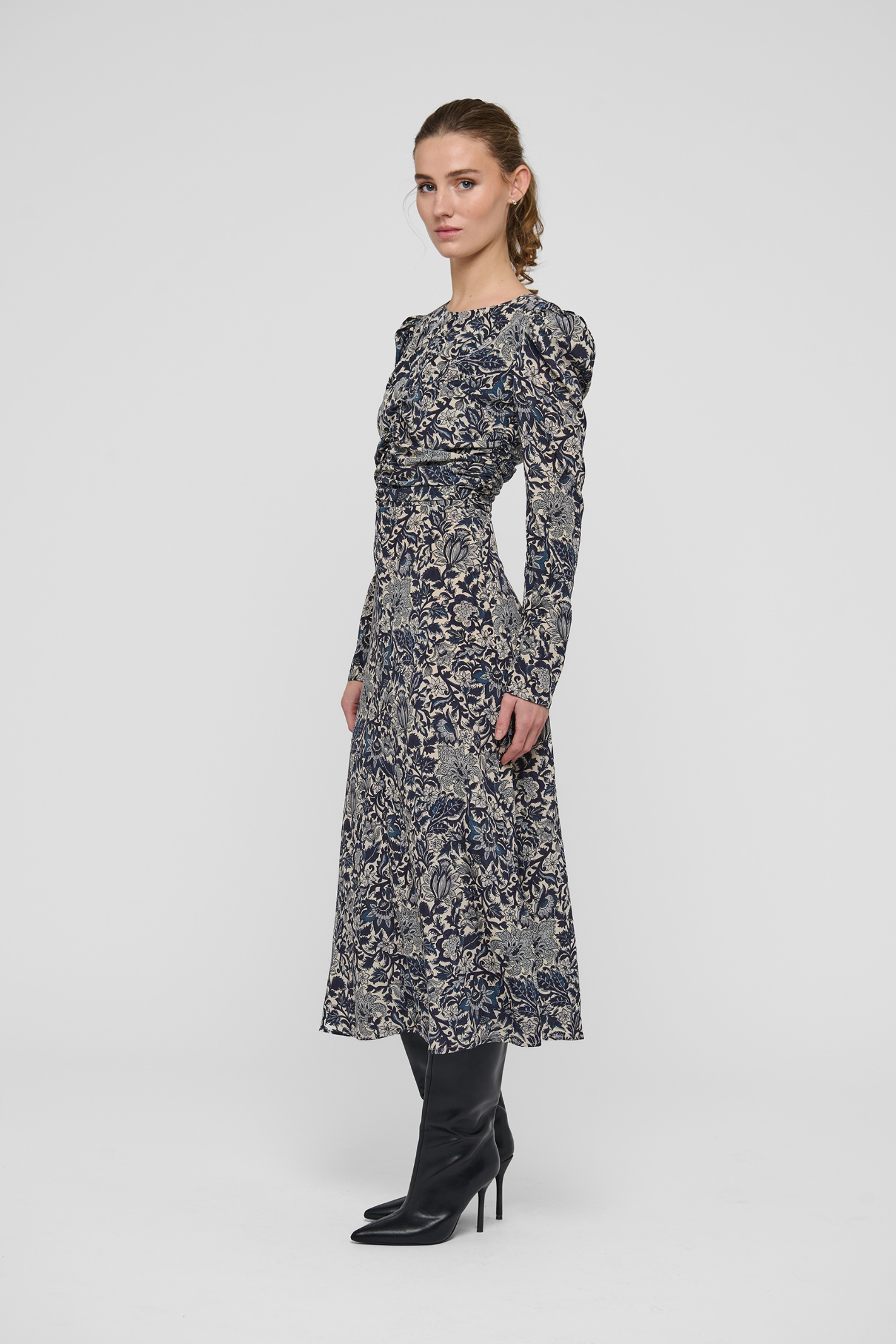 Shop the Dea Kudibal ClaudiaDEA Dress in Dentelle Midnight at Dotique. A luxurious stretch silk midi dress with a flattering ruched waist and floral print.