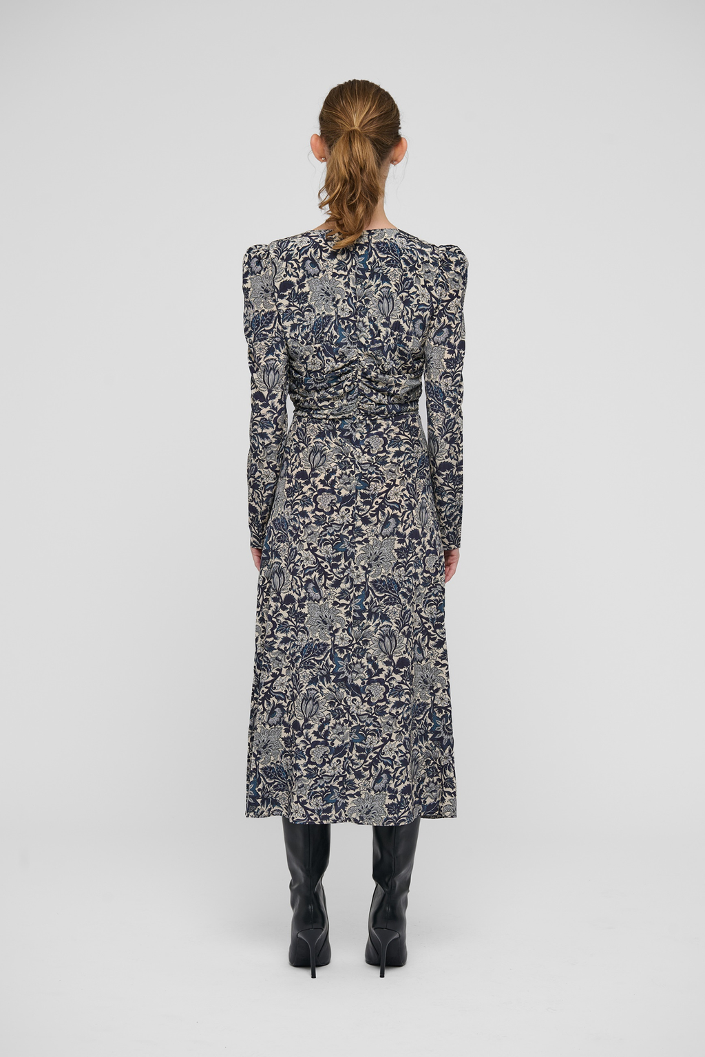 Shop the Dea Kudibal ClaudiaDEA Dress in Dentelle Midnight at Dotique. A luxurious stretch silk midi dress with a flattering ruched waist and floral print.
