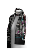 Dotique Dolcezza 76904 assorted woven scarf featuring a black cityscape-inspired artistic print with white, teal, pink and red accents.