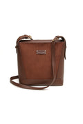 Front view of the Alice Wheeler Kensington Suedette Crossbody Bag in Chocolate. Shop Alice Wheeler at Dotique.