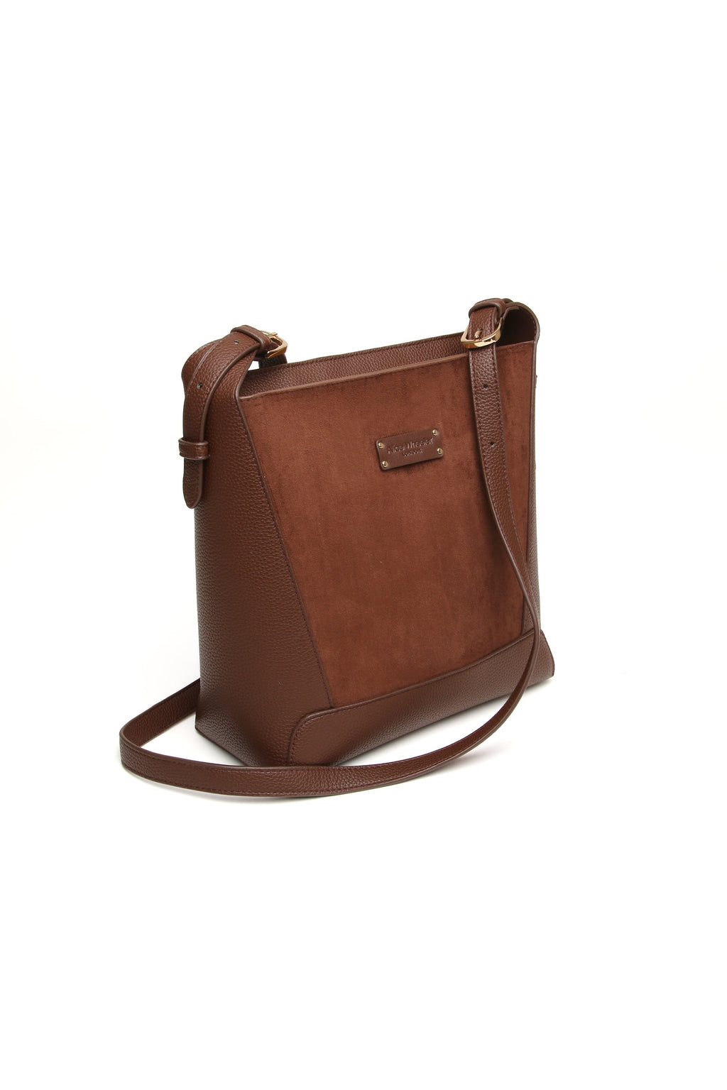 Angled view of the Alice Wheeler Kensington Suedette Crossbody Bag in Chocolate. Shop Alice Wheeler at Dotique.