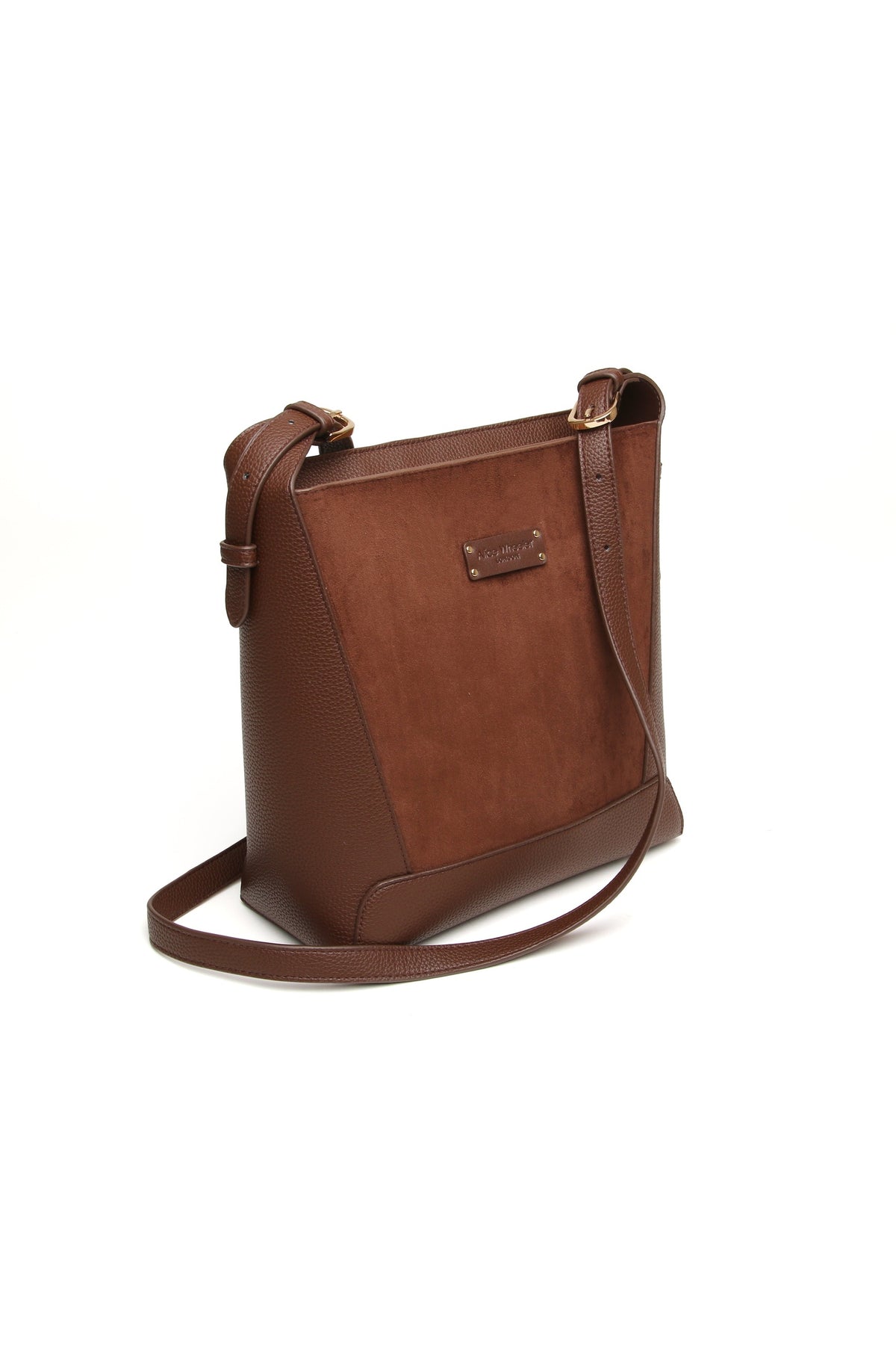 Angled view of the Alice Wheeler Kensington Suedette Crossbody Bag in Chocolate. Shop Alice Wheeler at Dotique.