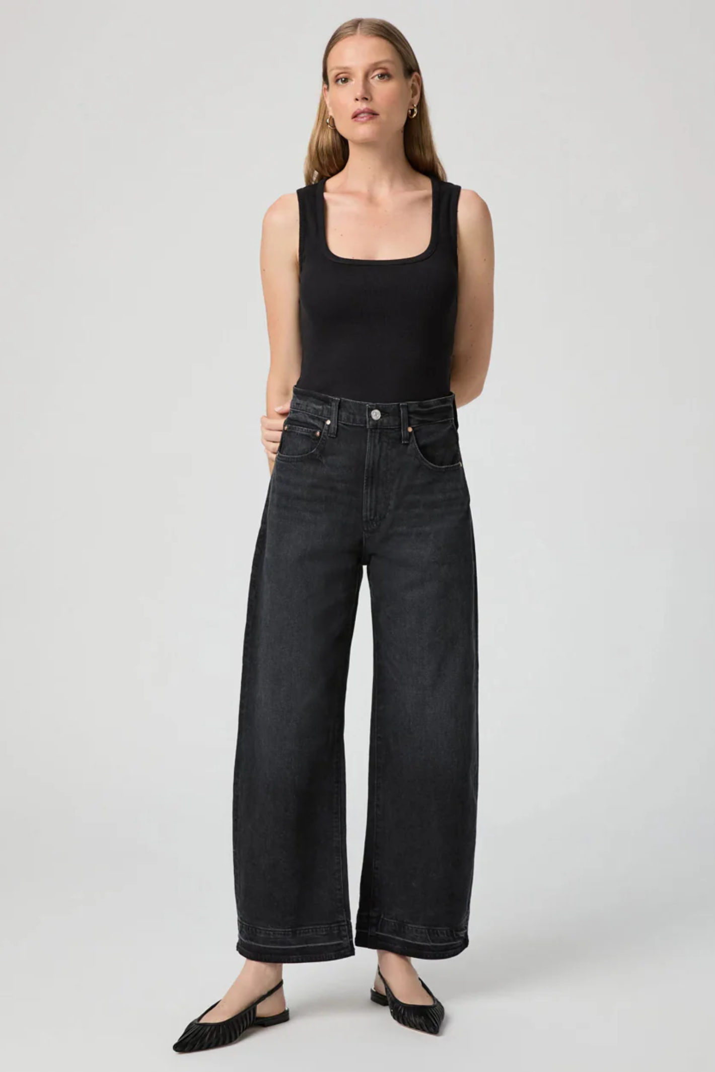 Arellia Ankle Jeans in Black Void — high-rise, ankle-length barrel-leg with raw hem. Soft stretch denim and easy styling for everyday wear. Shop at Dotique.