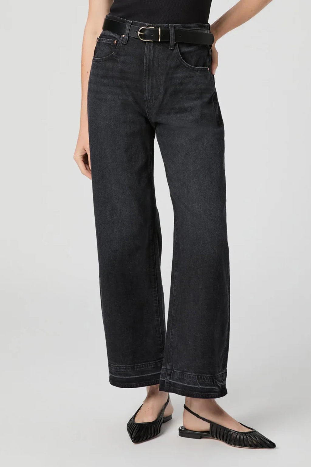 Arellia Ankle Jeans in Black Void — high-rise, ankle-length barrel-leg with raw hem. Soft stretch denim and easy styling for everyday wear. Shop at Dotique.
