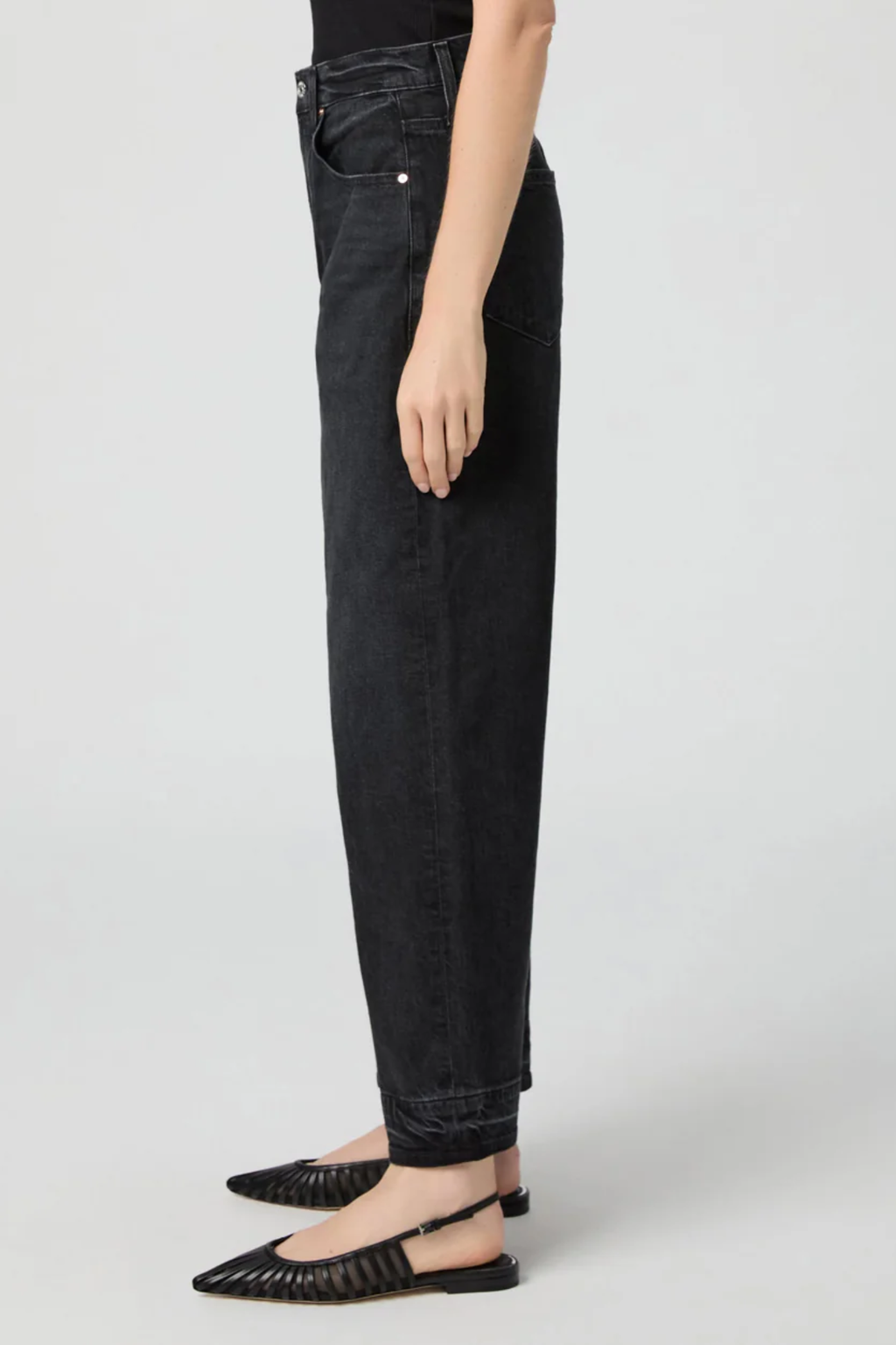 Arellia Ankle Jeans in Black Void — high-rise, ankle-length barrel-leg with raw hem. Soft stretch denim and easy styling for everyday wear. Shop at Dotique.