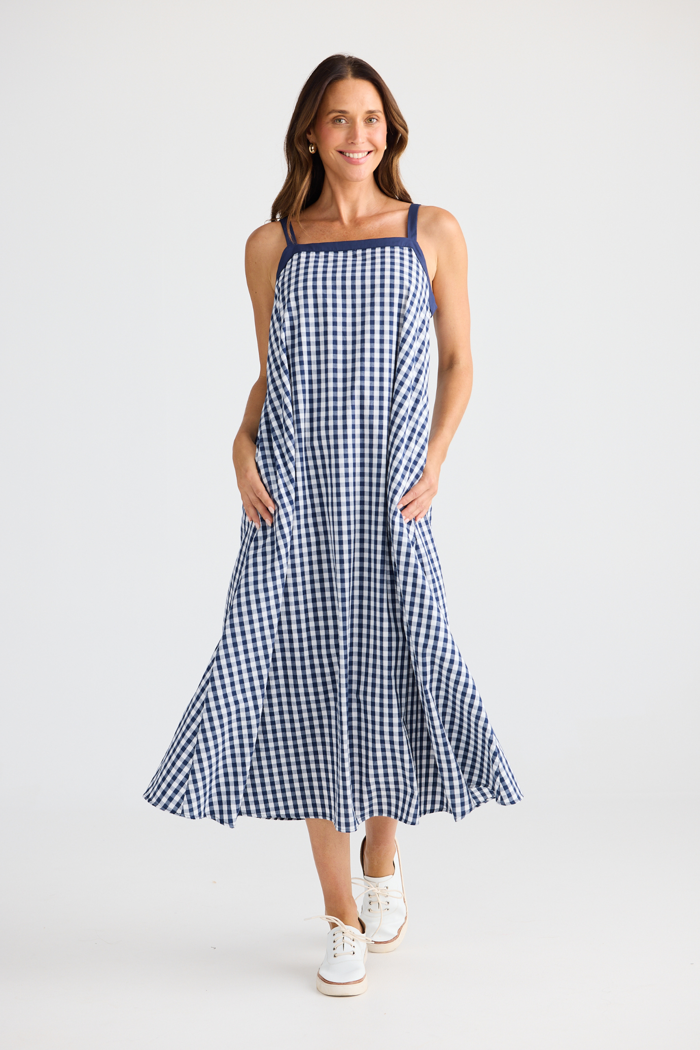 Brave + True Erica Dress in navy gingham. Cotton midi dress with shoulder straps, back tie detail and relaxed fit. Shop Brave + True at Dotique.
