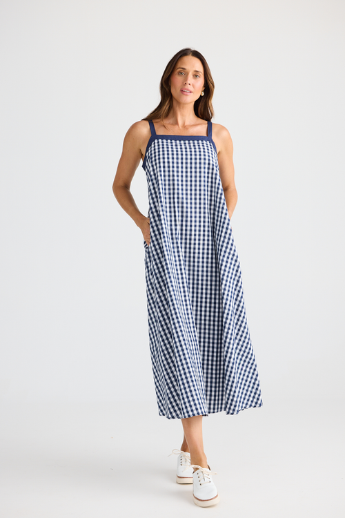 Brave + True Erica Dress in navy gingham. Cotton midi dress with shoulder straps, back tie detail and relaxed fit. Shop Brave + True at Dotique.