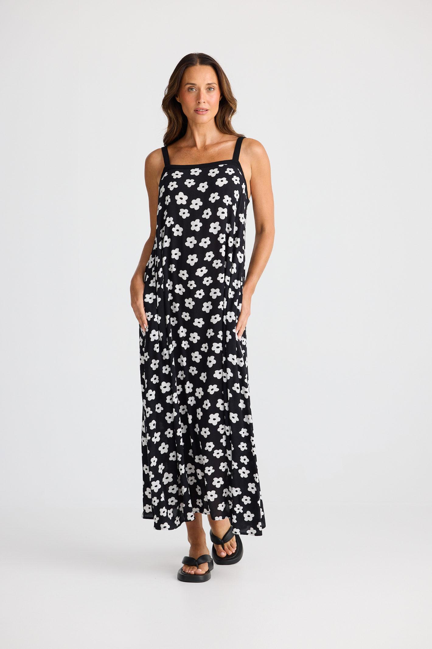 Brave + True Erica Dress in ditsy daisy. Viscose midi dress with shoulder straps, back tie detail and relaxed fit. Shop Brave + True at Dotique.