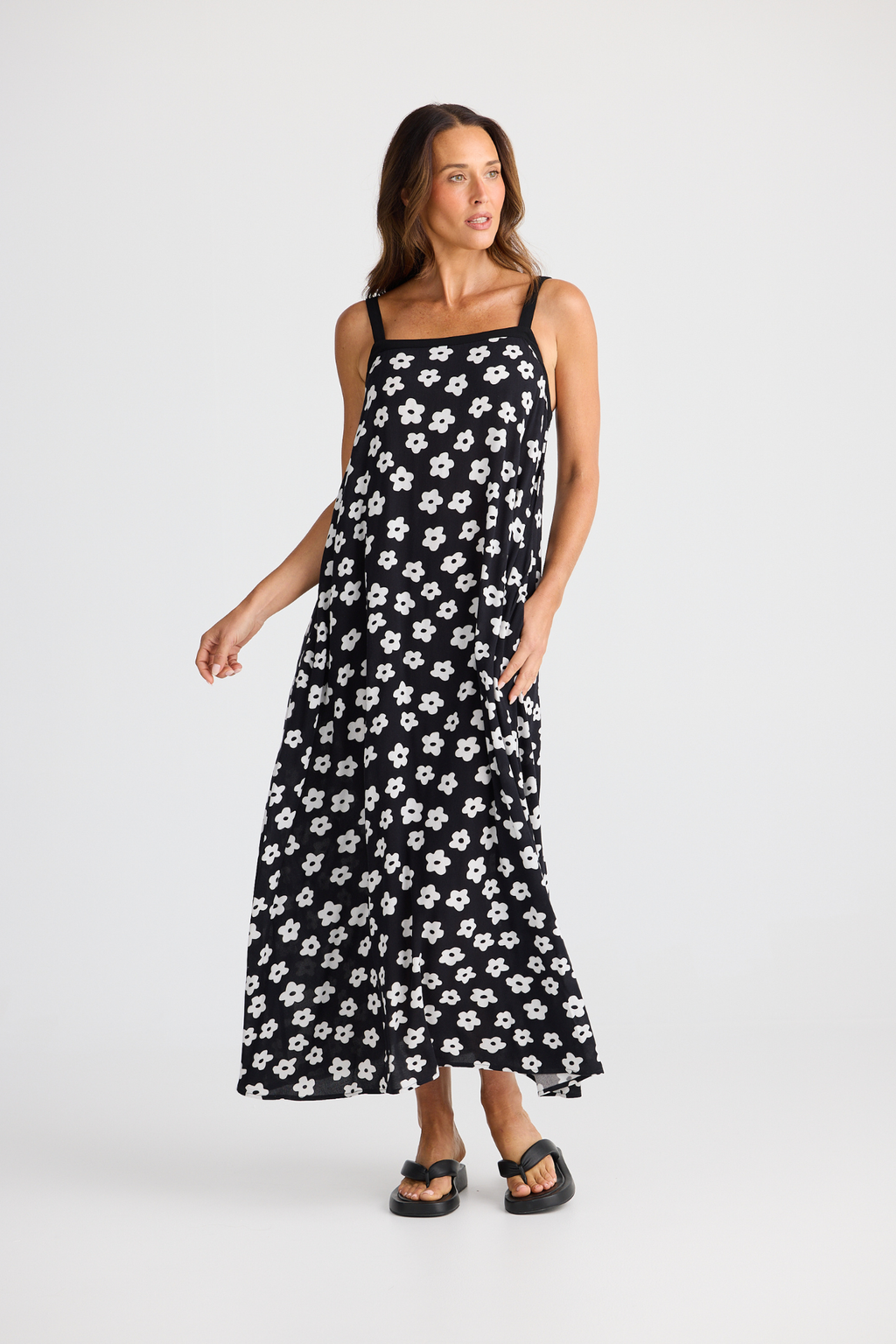 Brave + True Erica Dress in ditsy daisy. Viscose midi dress with shoulder straps, back tie detail and relaxed fit. Shop Brave + True at Dotique.