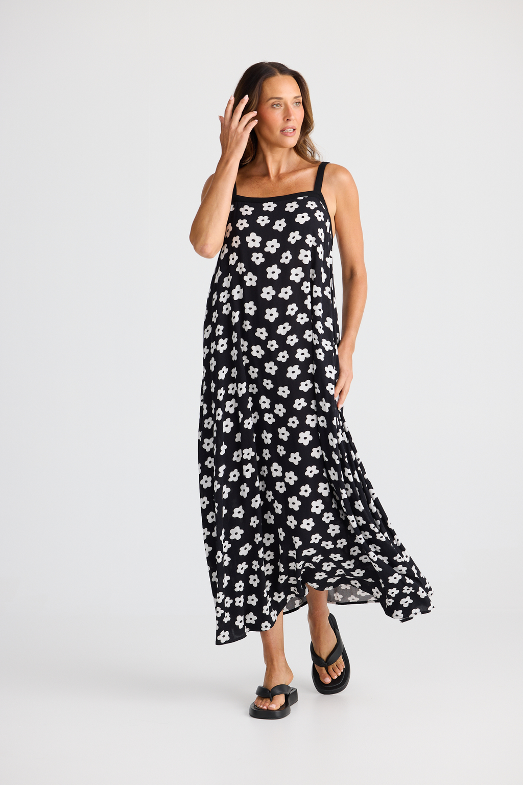 Brave + True Erica Dress in ditsy daisy. Viscose midi dress with shoulder straps, back tie detail and relaxed fit. Shop Brave + True at Dotique.