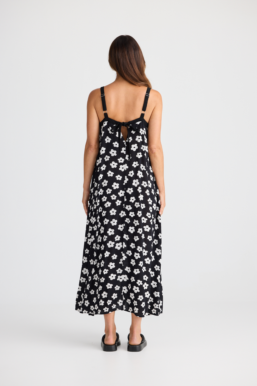 Brave + True Erica Dress in ditsy daisy. Viscose midi dress with shoulder straps, back tie detail and relaxed fit. Shop Brave + True at Dotique.