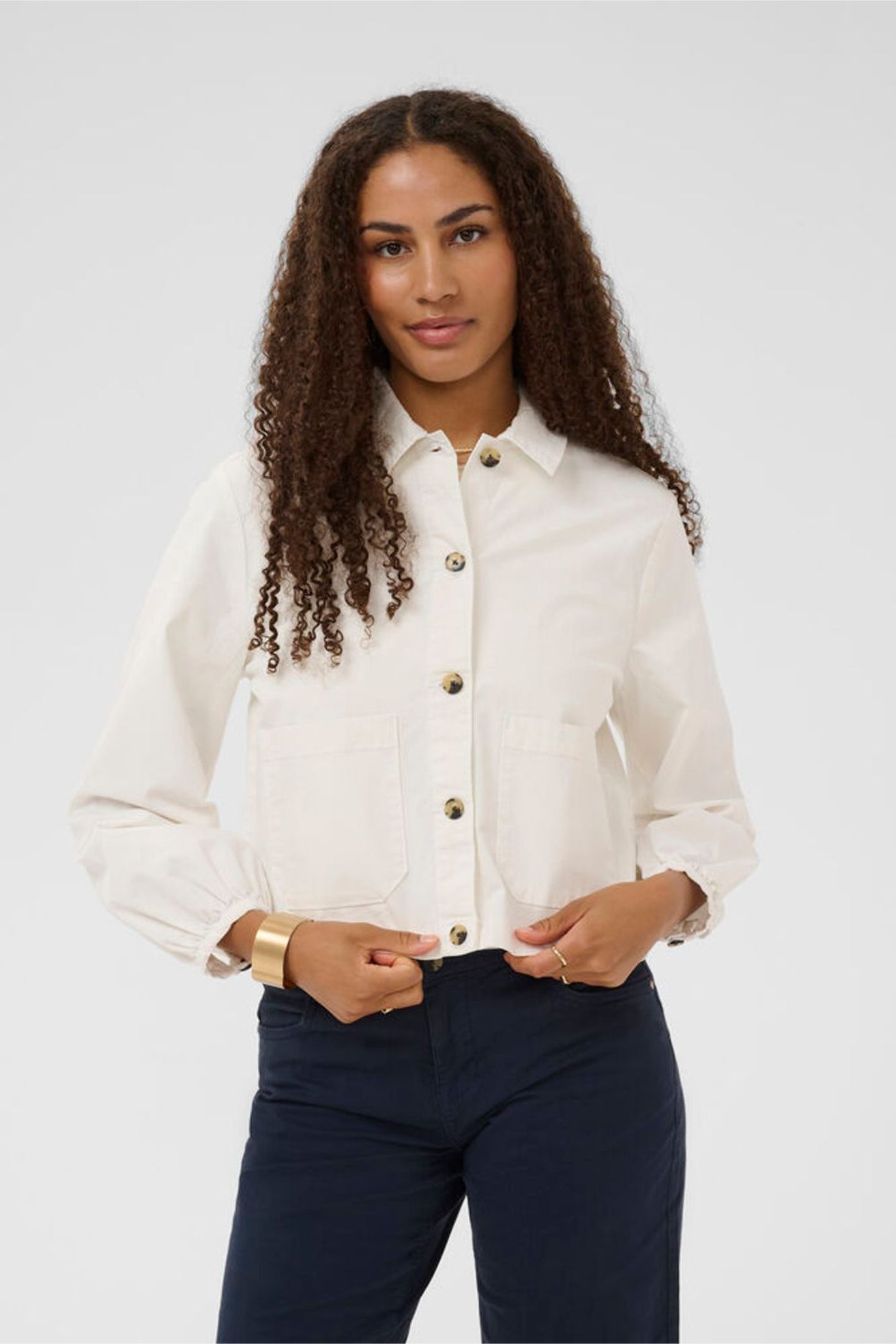 Woman wearing Cream 10614741 CRBerta Twill Jacket Snow White by Cream, shop Cream at Dotique for stylish outerwear.