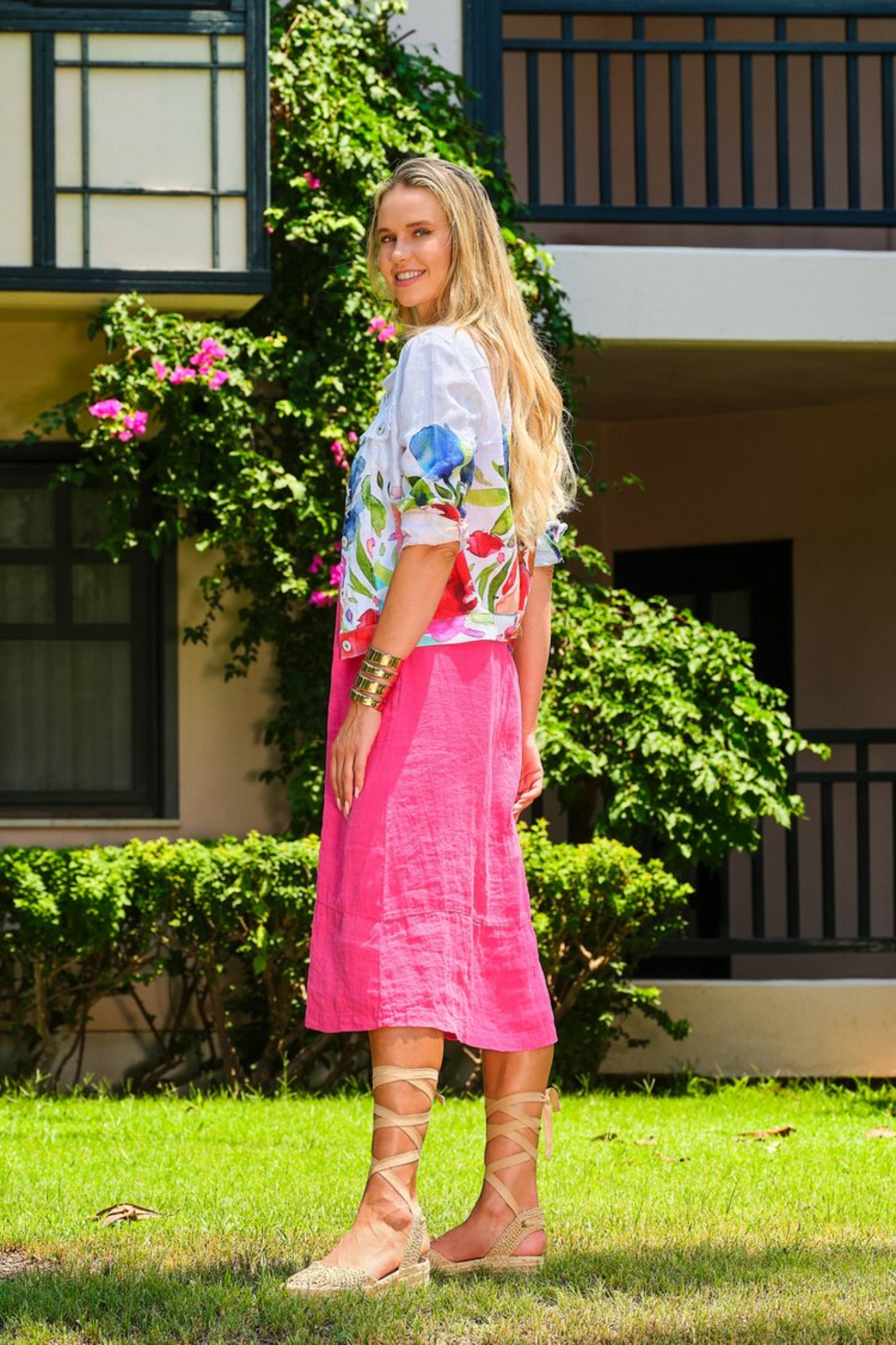Model wearing Dolcezza Floral Print Linen Jacket 26705 featuring colorful floral designs on white linen by Dolcezza, shop Dolcezza at Dotique.