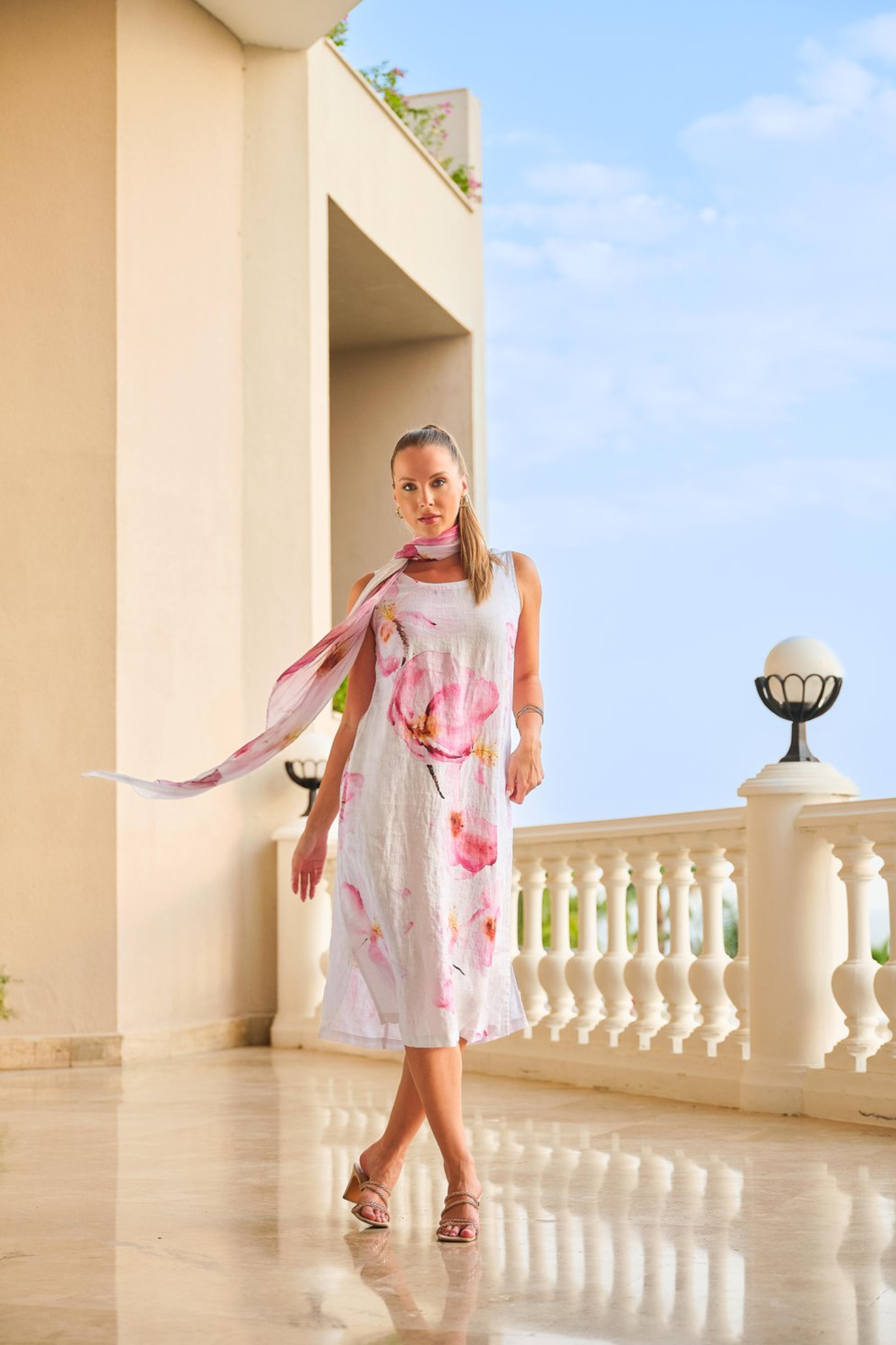 Pink floral scarf by Dolcezza made from 100% viscose. Lightweight, soft and perfect for adding colour to everyday outfits. Shop at Dotique.