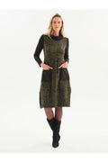 Dotique Dolcezza 76114 assorted abstract print knit dress with a roll neckline, contrast black sleeves and front patch pockets.