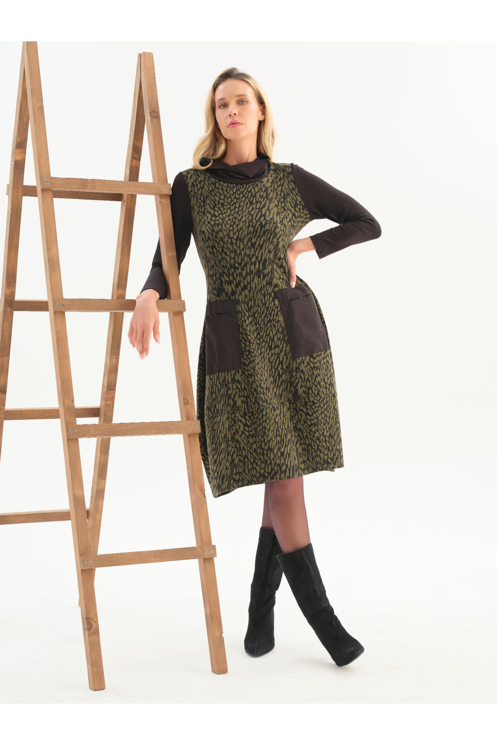 Dotique Dolcezza 76114 assorted abstract print knit dress with a roll neckline, contrast black sleeves and front patch pockets.