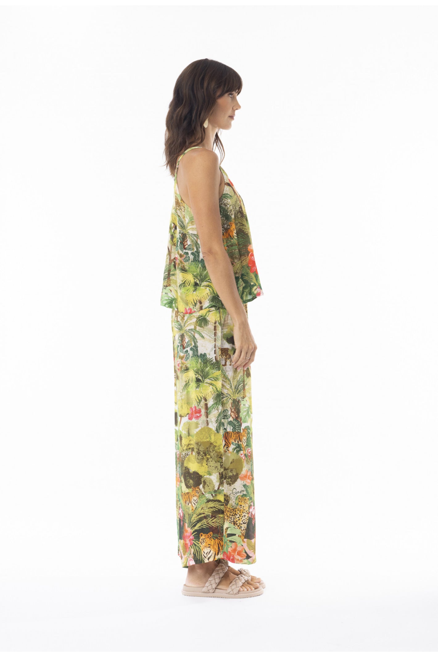 Side profile of model wearing Escape 16003 Cecilia Print Wide Leg Trousers by Escape Shop Escape at Dotique