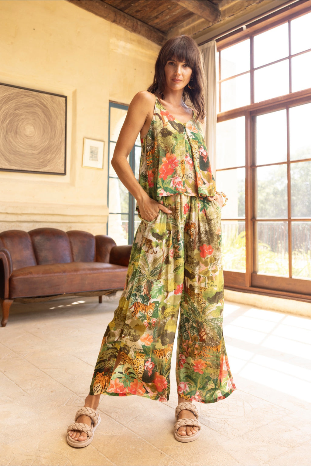 Woman modeling Escape 16003 Cecilia Print Wide Leg Trousers by Escape Shop Escape at Dotique in sunlit room