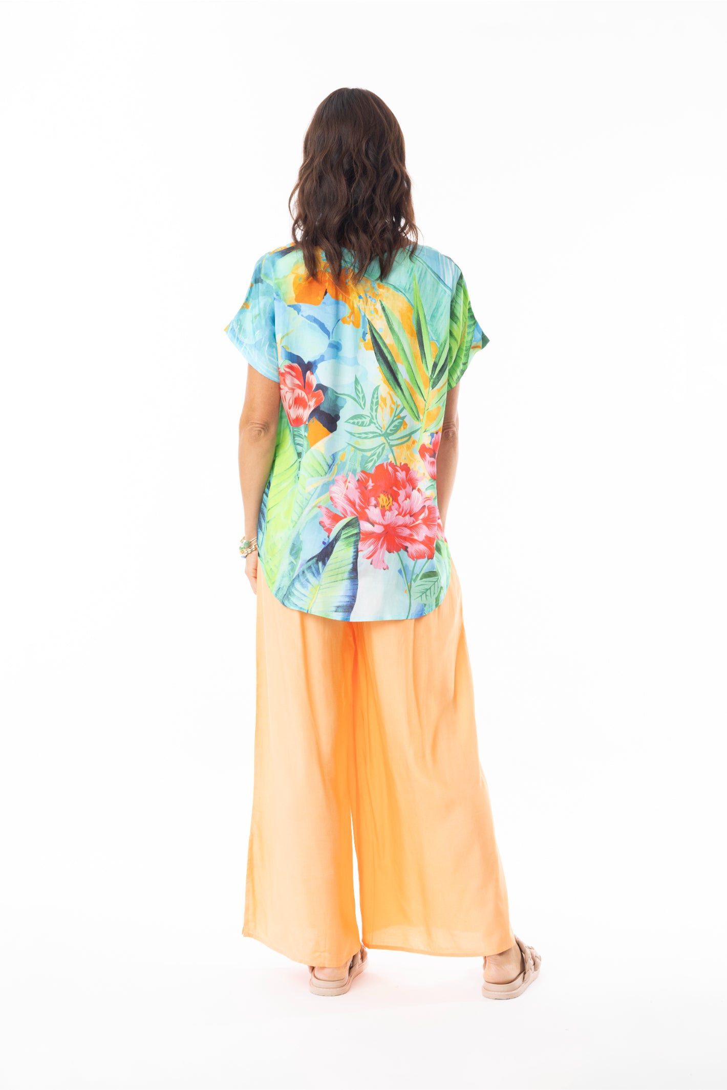 Back view of model wearing Escape 72541 Evelin Top Print by Escape, shop Escape styles at Dotique for colorful summer looks