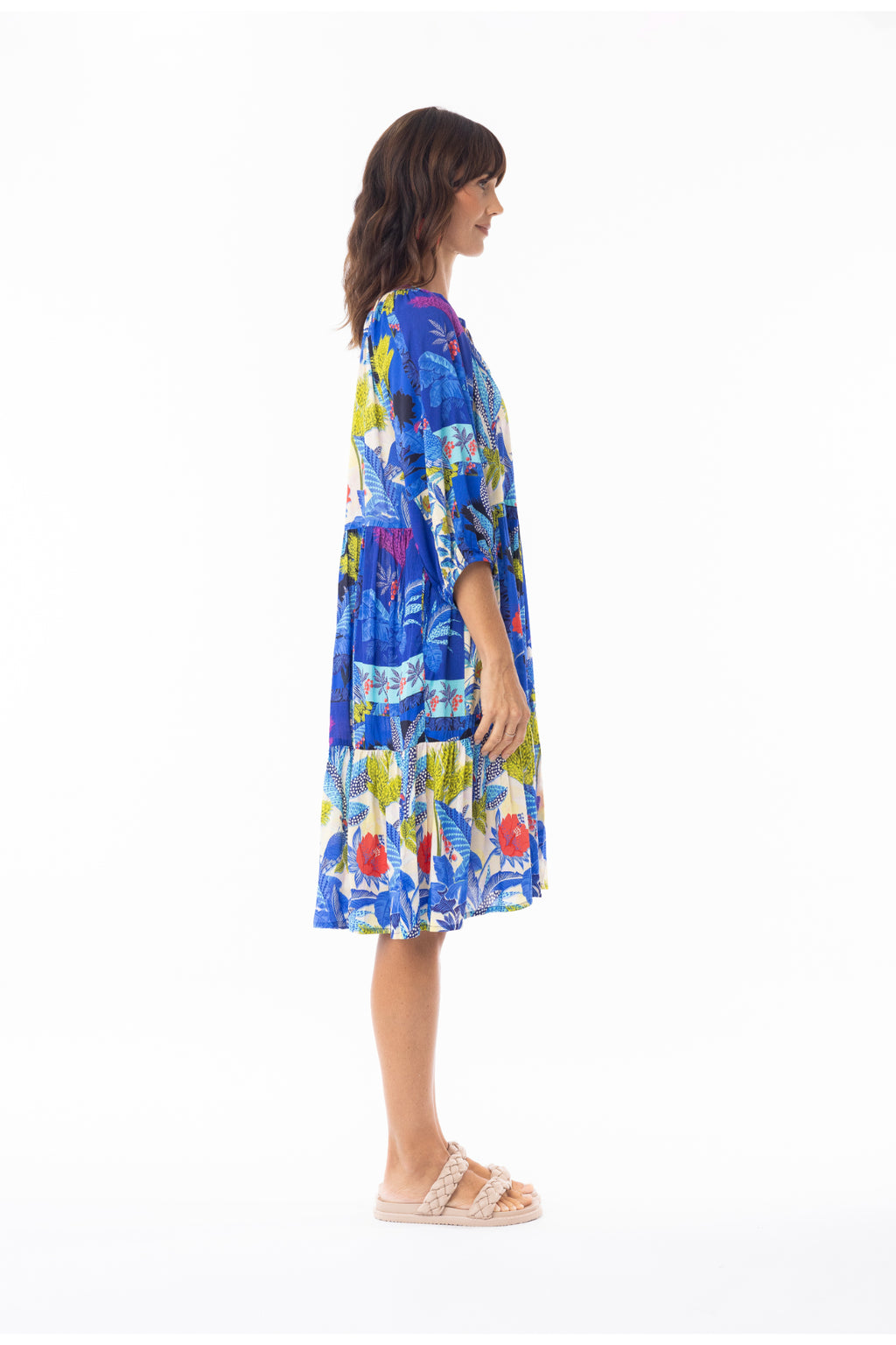 Side view of woman wearing bright Escape 30120 Luna Dress V Print by Escape, shop Escape at Dotique
