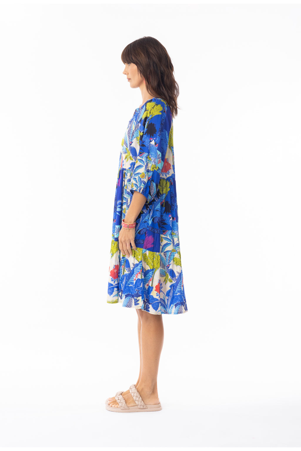 Profile view of model wearing Escape 30120 Luna Dress V Print by Escape, shop Escape at Dotique for bold floral style