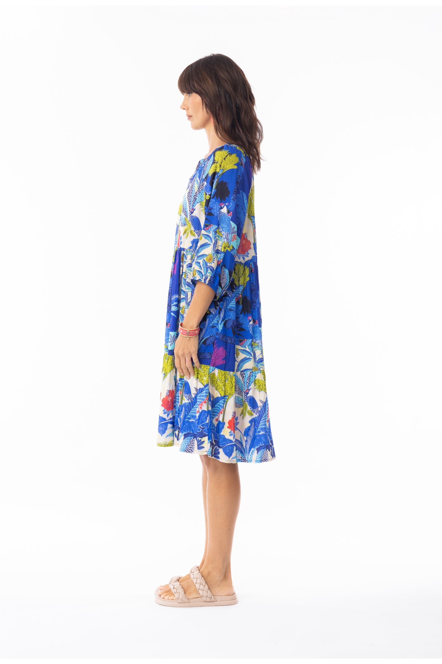 Profile view of model wearing Escape 30120 Luna Dress V Print by Escape, shop Escape at Dotique for bold floral style