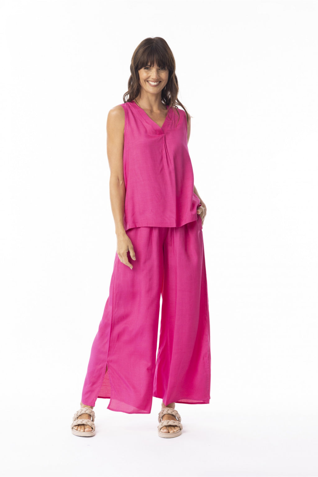 Model wearing Escape 56216 Lux Wide Leg Trousers Hot Pink by Escape, shop Escape at Dotique for bold style