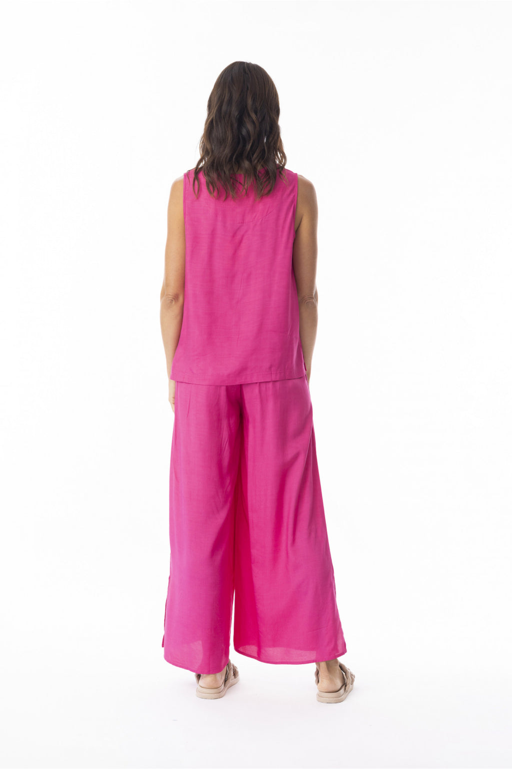 Rear view of model wearing Escape 56216 Lux Wide Leg Trousers Hot Pink by Escape, shop Escape at Dotique for vibrant style