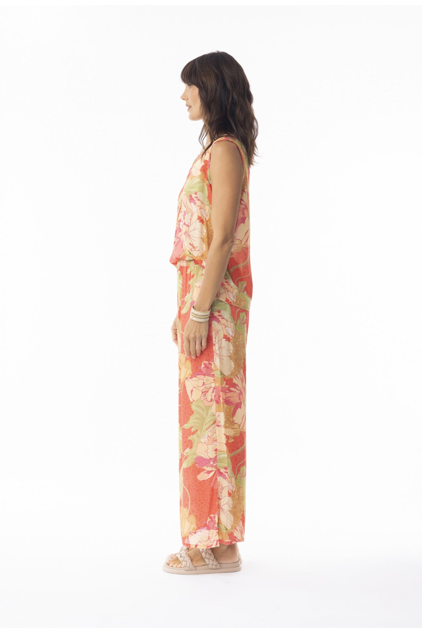 Side profile of model in Escape 9635 Rosa Print Wide Leg Trousers by Escape, shop Escape at Dotique for stylish relaxed looks