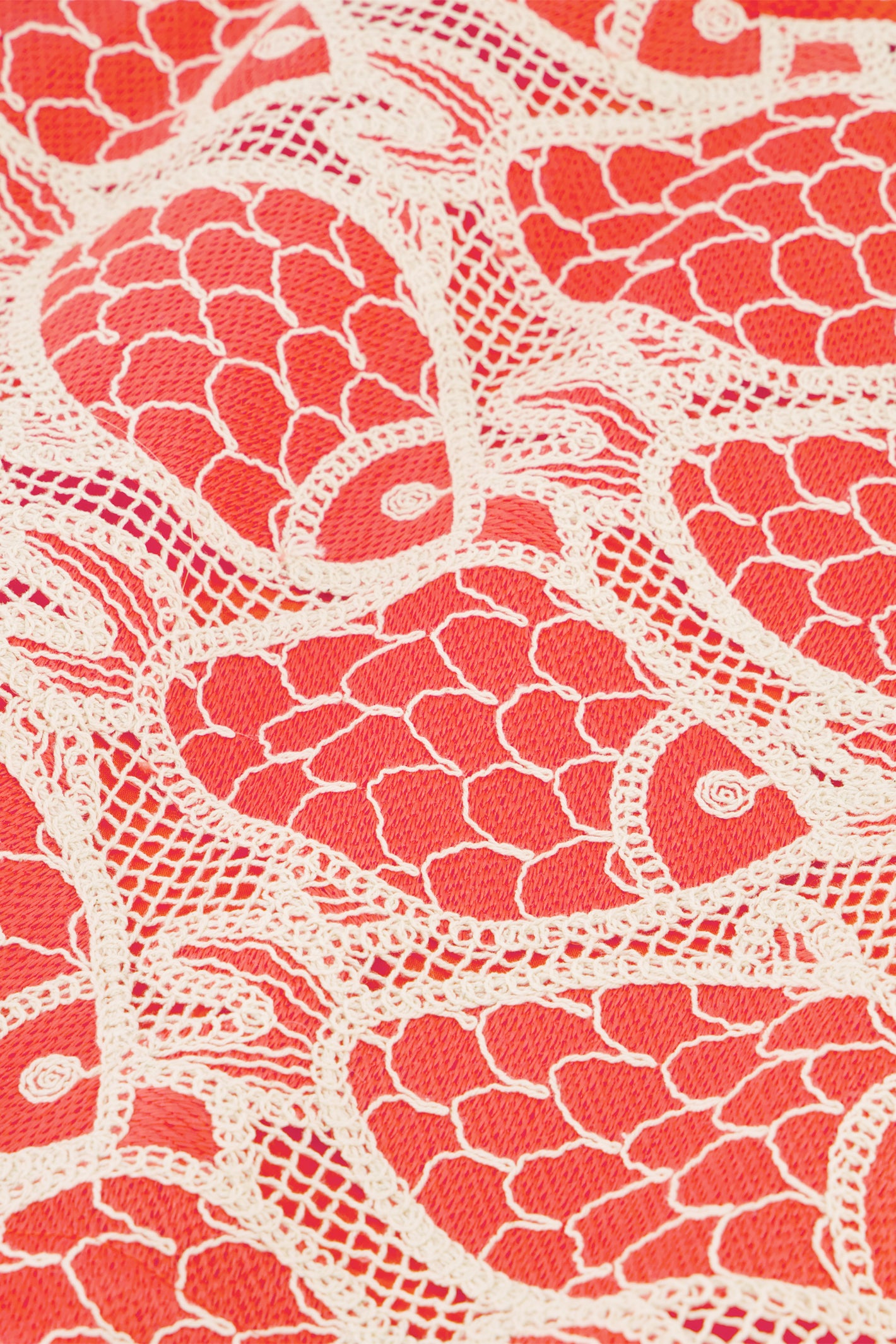Close-up of vibrant fish pattern fabric in red and cream from Fabienne Chapot Cato Skirt Tangerine Tango, shop Fabienne Chapot at Dotique.