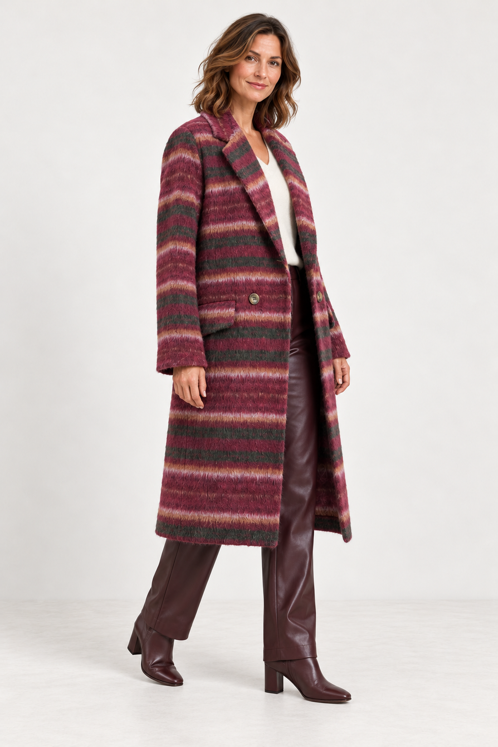 Foil FO8561 Cover Story Coat in Dark Cherry Check, angled model view with burgundy faux-leather trousers and a cream V-neck jumper. Shop Foil at Dotique.
