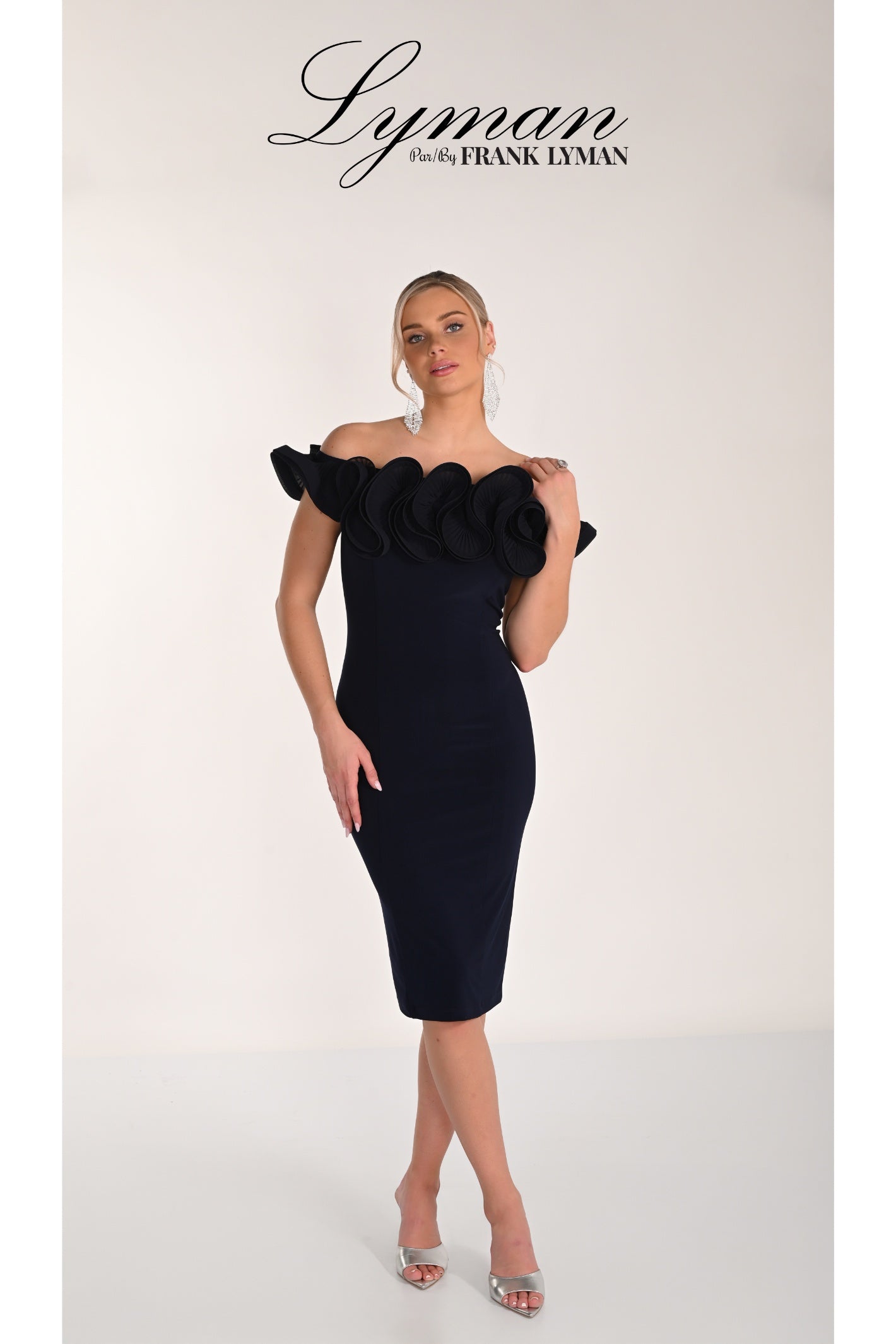 Woman wearing Frank Lyman 268015 Midnight Off-Shoulder Ruffle Dress by Frank Lyman, shop Frank Lyman at Dotique.