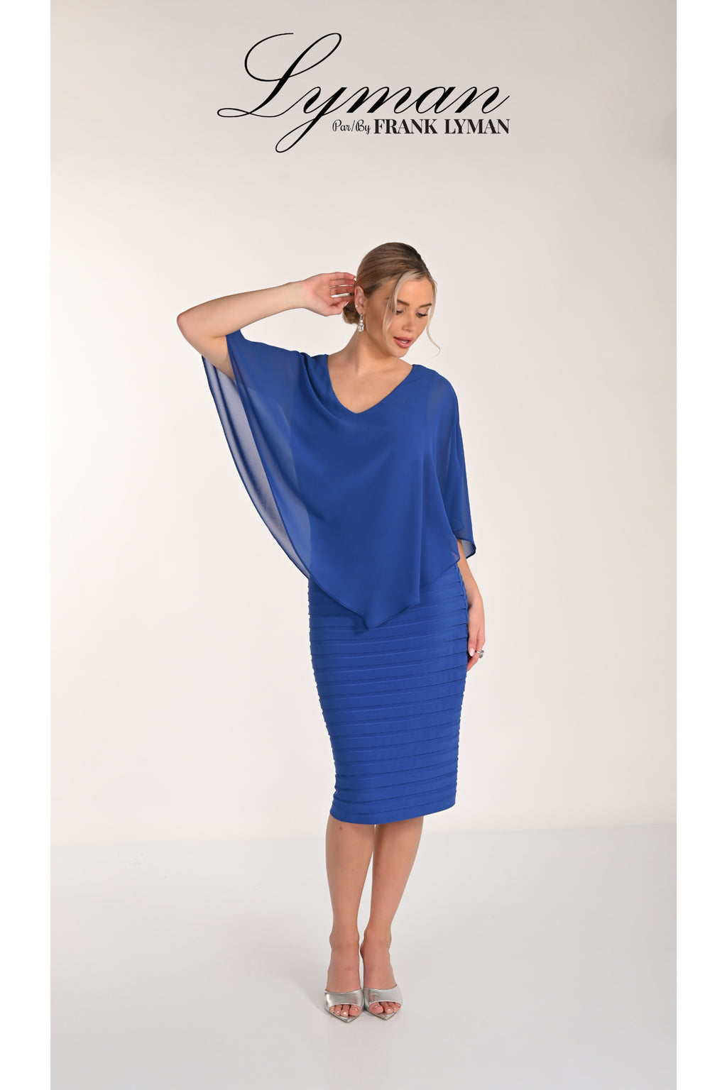 Frank Lyman 268023 Royal Blue Chiffon Overlay Dress by Frank Lyman modeled, shop Frank Lyman at Dotique.