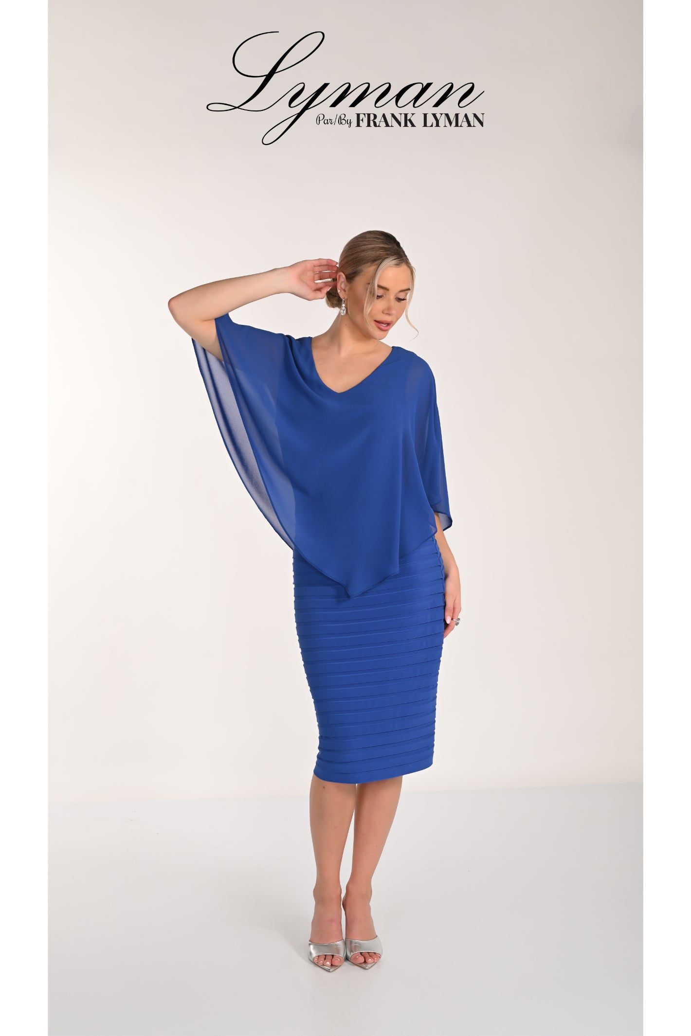 Frank Lyman 268023 Royal Blue Chiffon Overlay Dress by Frank Lyman modeled, shop Frank Lyman at Dotique.