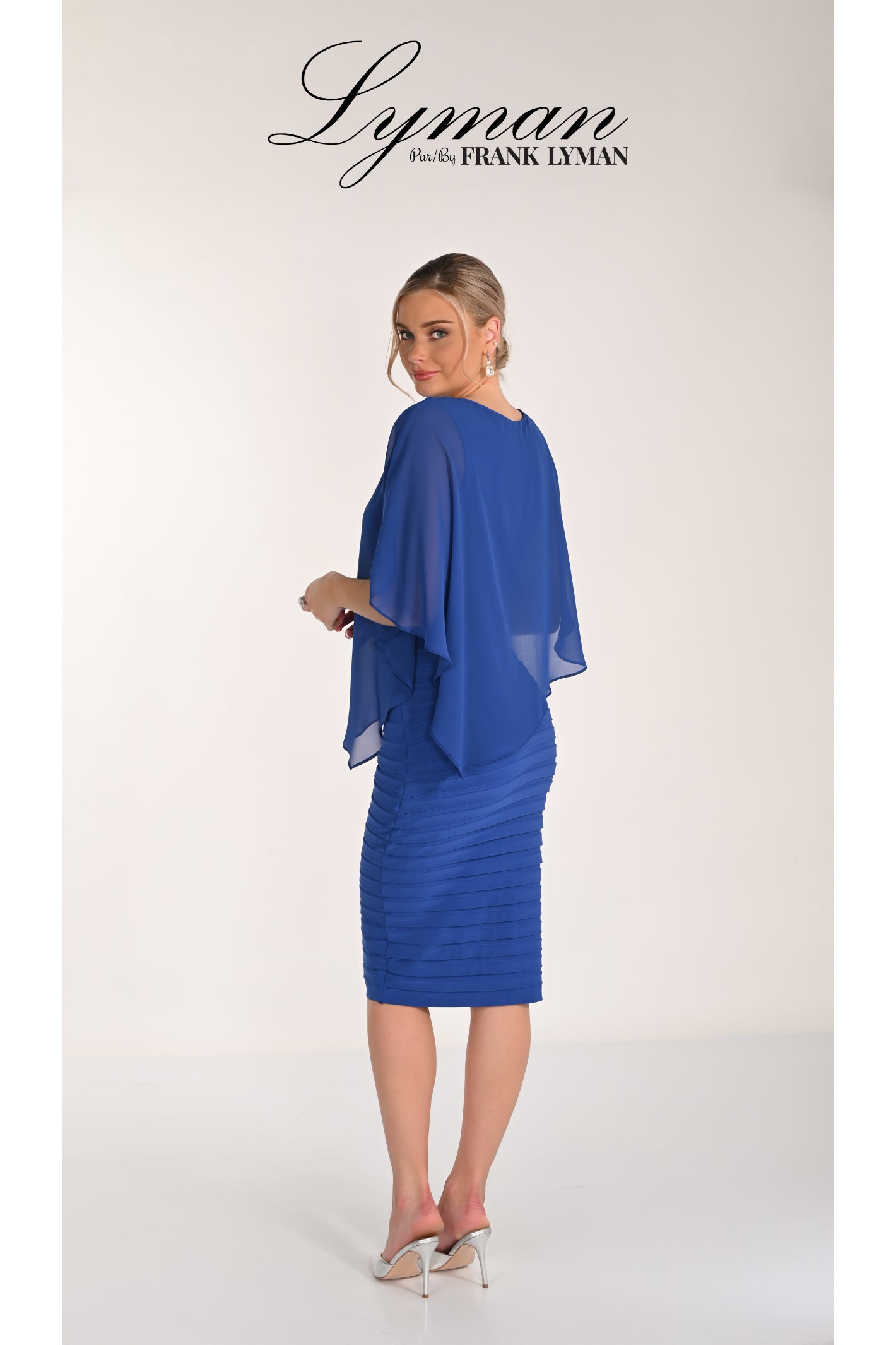 Woman wearing Frank Lyman 268023 Royal Blue Chiffon Overlay Dress by Frank Lyman, shop Frank Lyman at Dotique.