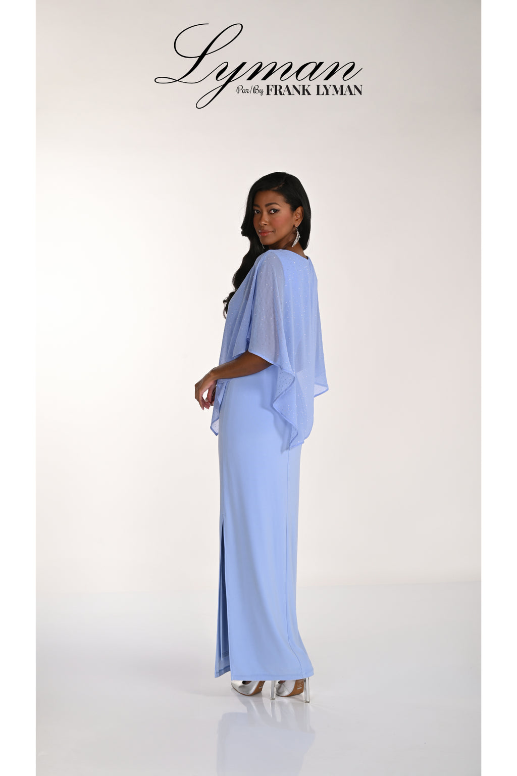 Elegant woman in Frank Lyman 268193 Periwinkle Embellished Overlay Occasion Dress by Frank Lyman Shop Dotique now