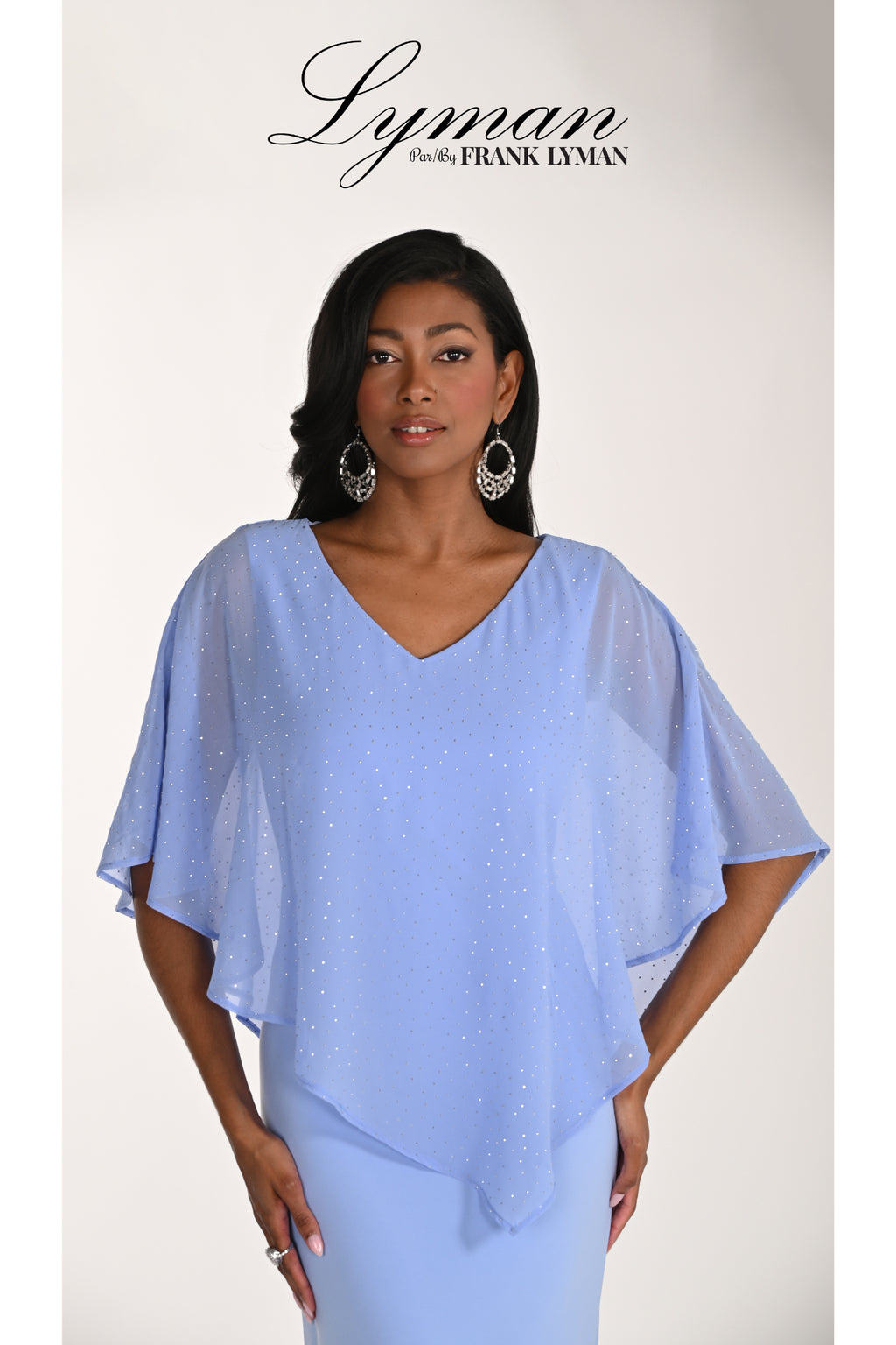 Elegant woman wearing Frank Lyman 268193 Periwinkle Embellished Overlay Occasion Dress by Frank Lyman shop at Dotique