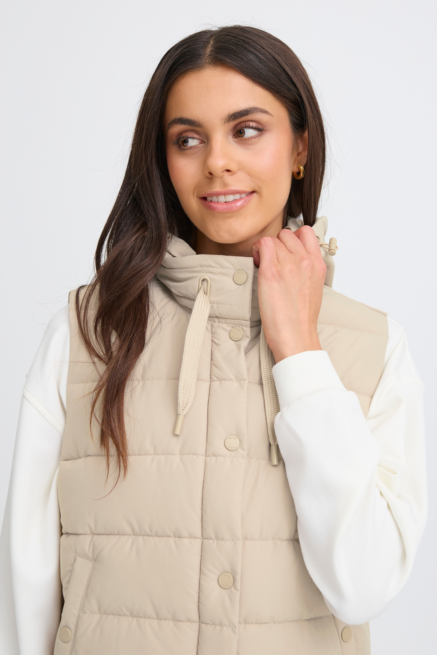 Lightweight padded gilet in Oxford Tan by Fransa. An easy everyday layer for spring and autumn. Shop online or in store at Dotique.