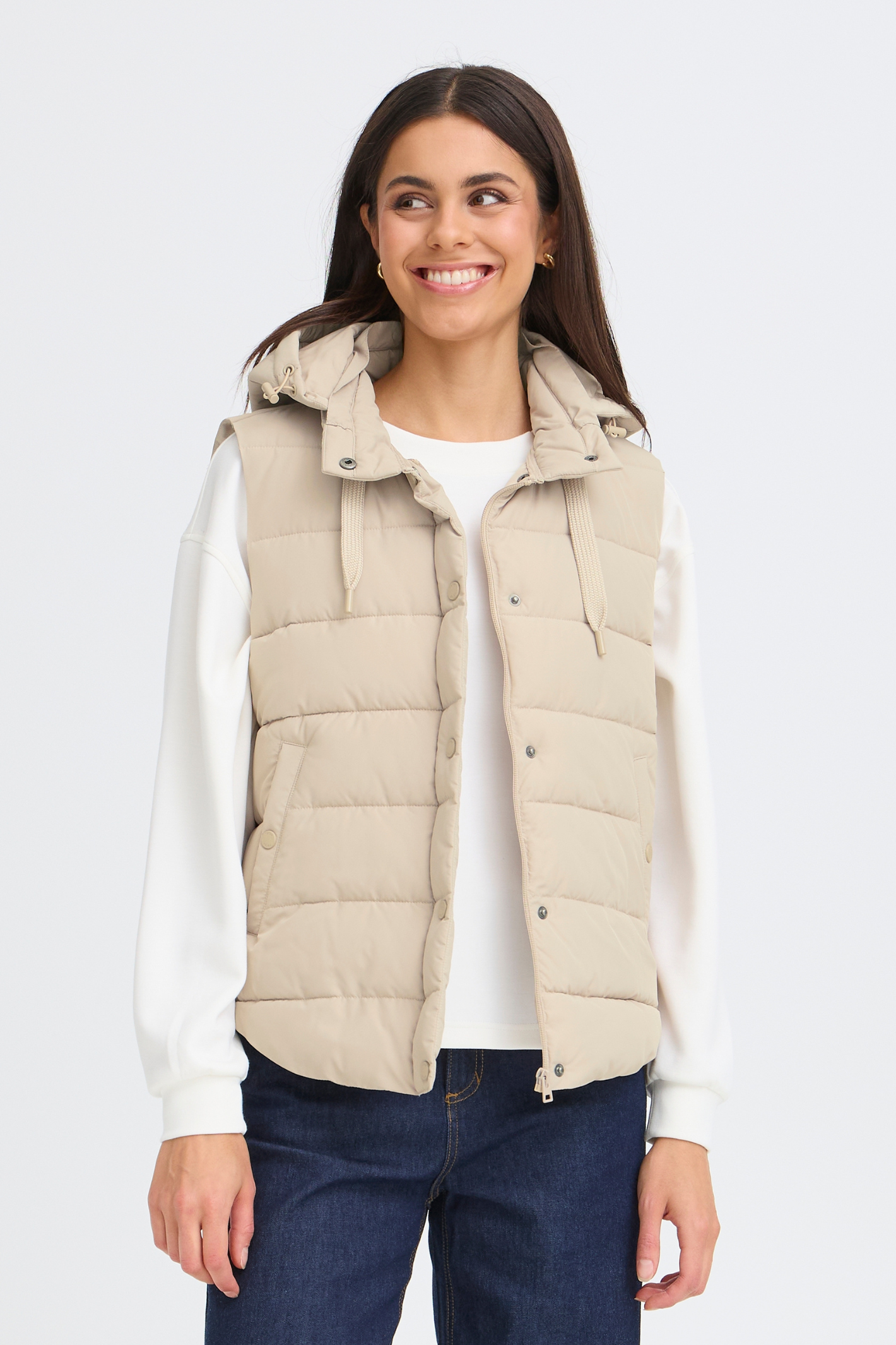Lightweight padded gilet in Oxford Tan by Fransa. An easy everyday layer for spring and autumn. Shop online or in store at Dotique.