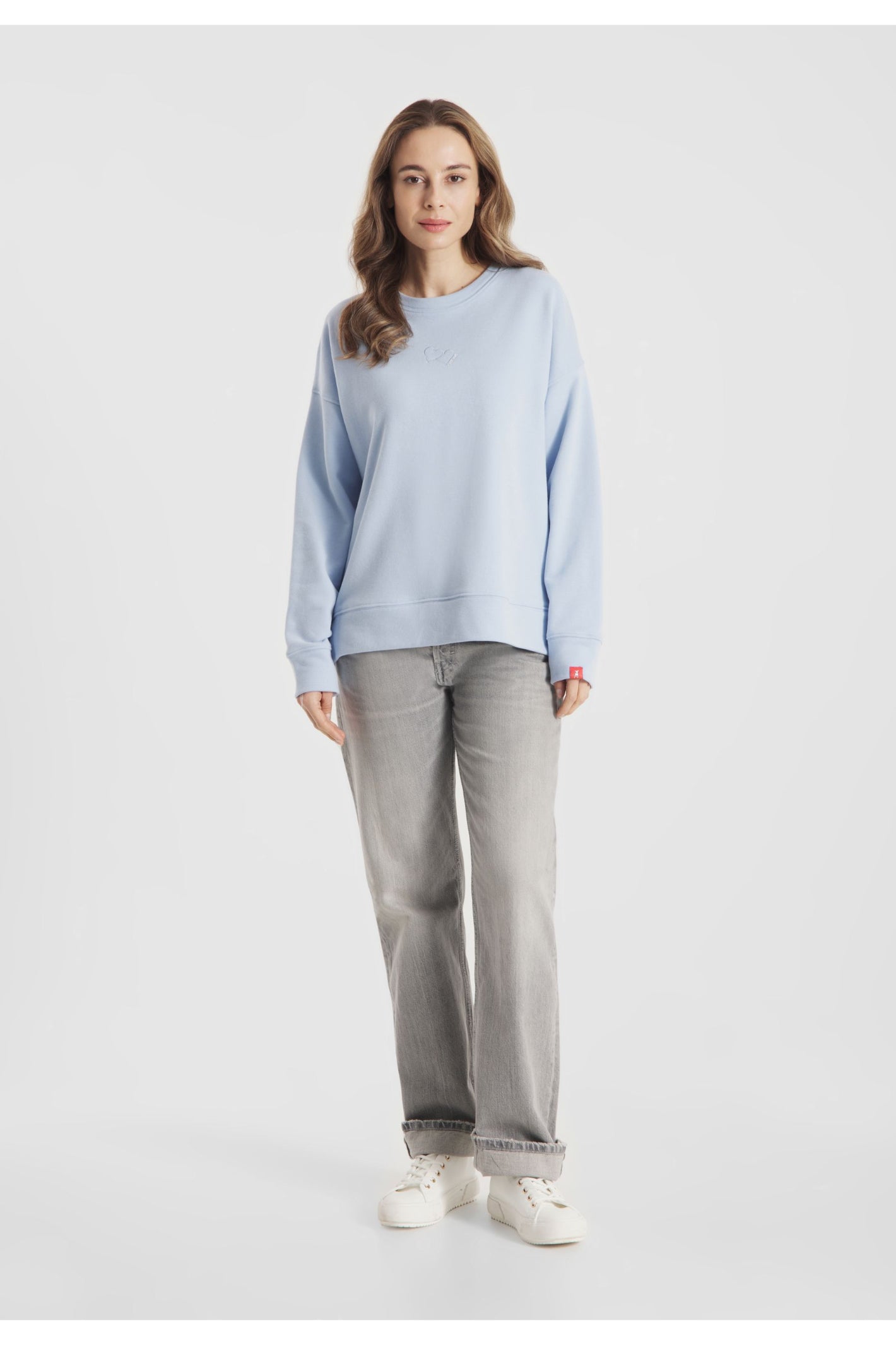 Woman wearing Frieda & Freddies 261222 Light Blue Sweatshirt by frieda & freddies, shop frieda & freddies at Dotique full front view