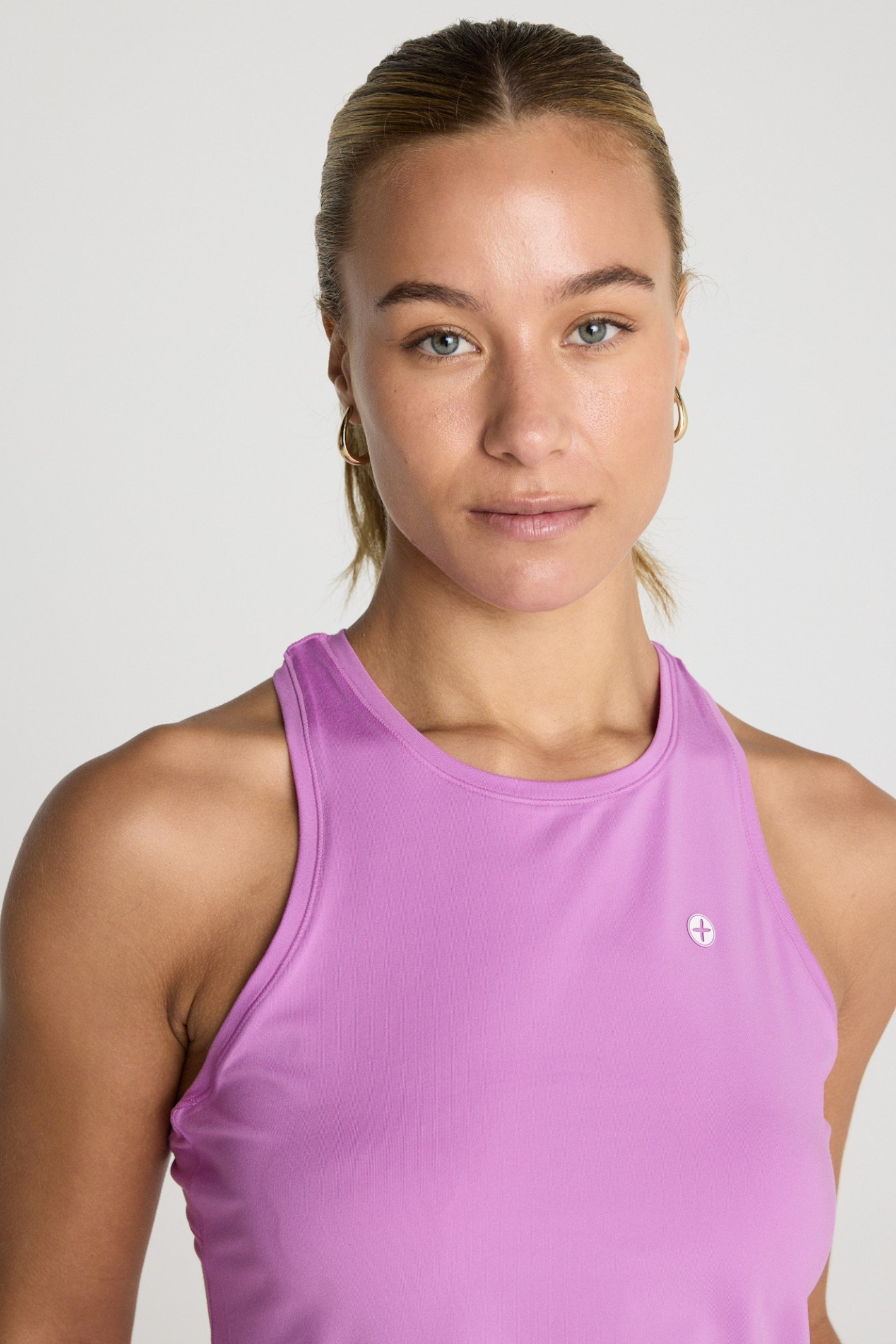 Woman wearing Gym+Coffee Relentless Racer Back Vest Neon Pink by Gym+Coffee, shop the Gym+Coffee range at Dotique.