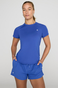 Gym+Coffee Relentless Tee in Tidal Blue worn by model, shop Gym+Coffee at Dotique for stylish activewear options.