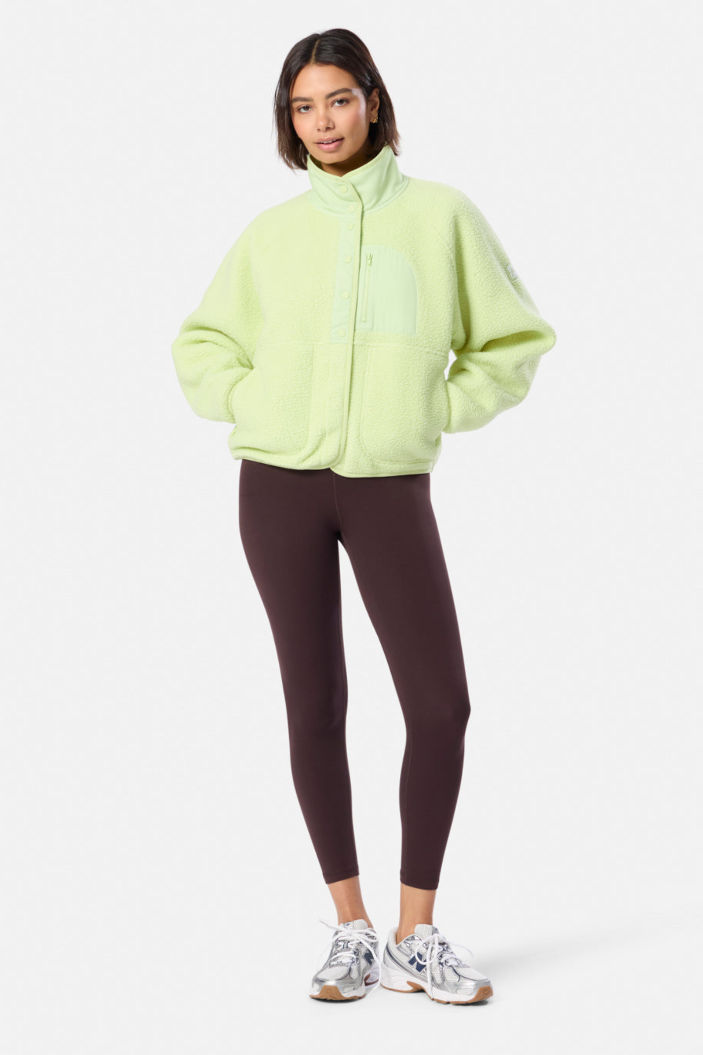 Woman wearing Gym + Coffee Horizon Layer Up Jacket in in Lime Sorbet by Gym+Coffee, shop the vendor at Dotique for versatile outerwear