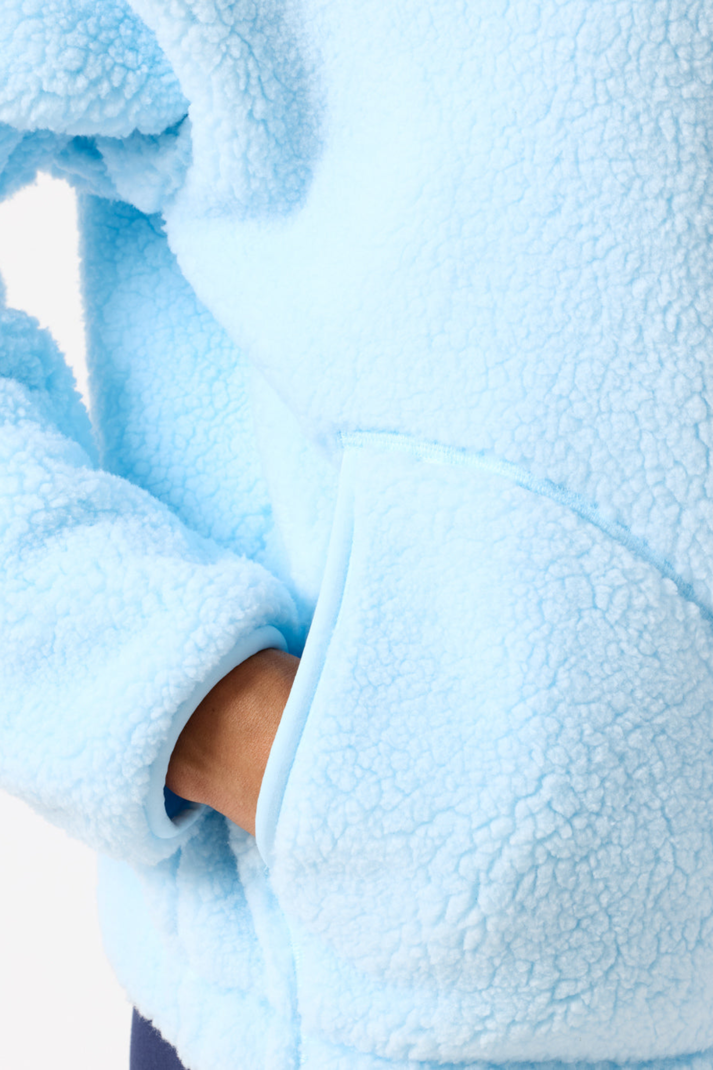 Close-up of Gym+Coffee Industry Fleece High Collar Jacket in Baby Blue by Gym+Coffee, shop this cozy jacket at Dotique.