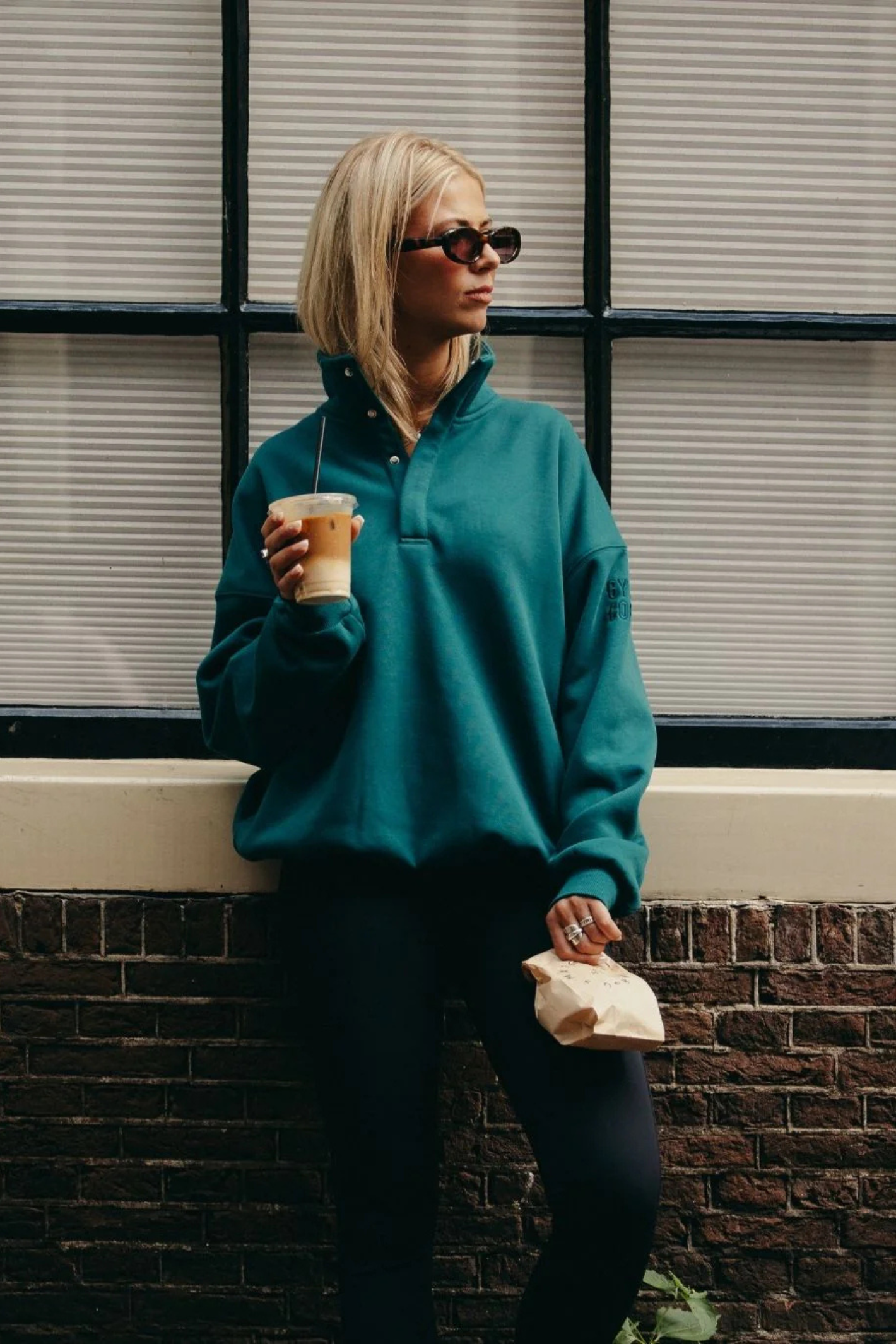 Gym+Coffee turquoise snap-collar Sierra sweatshirt with oversized fit and ribbed detail at Dotique.