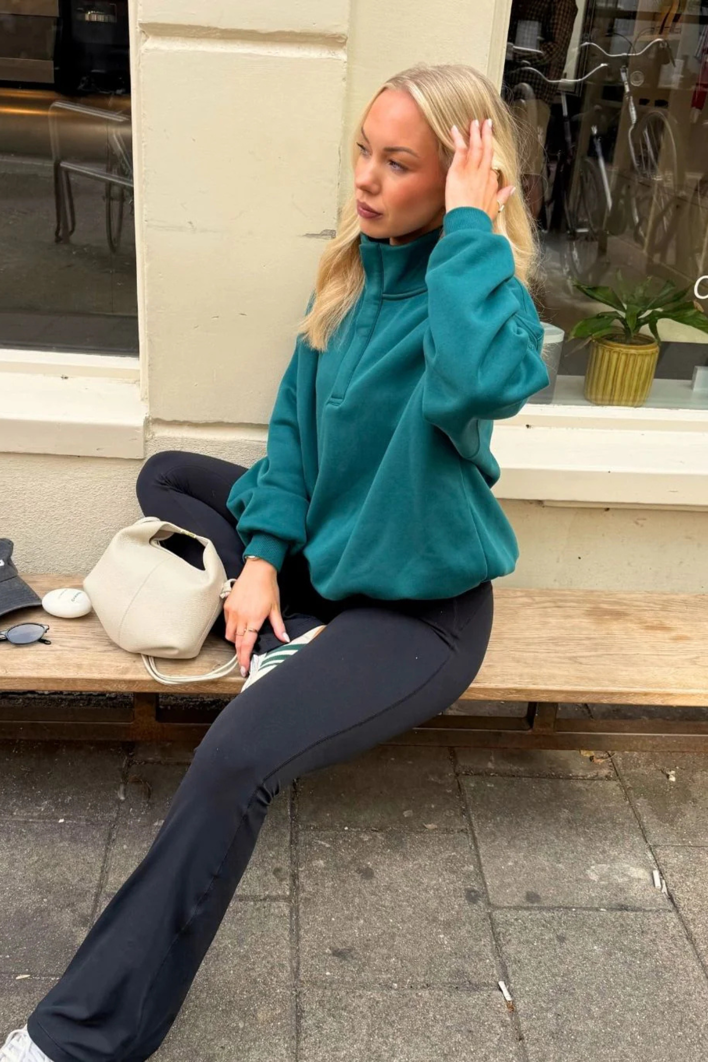 Gym+Coffee turquoise snap-collar Sierra sweatshirt with oversized fit and ribbed detail at Dotique.